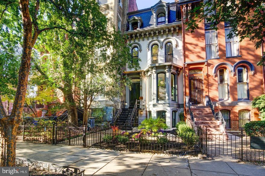 ***Significant Price Reduction..... 911 M Street NW is a striking Shaw residence where restored Victorian character meets refined modern luxury across four impeccably designed levels. Original architectural details have been thoughtfully preserved and elevated, creating a home that feels both timeless and distinctly current.
The main level impresses immediately with soaring 11.5-foot ceilings, elegant crown molding, herringbone-pattern French white oak floors, and layered designer lighting. A discreet butler’s pantry transitions seamlessly into a chef-caliber kitchen outfitted with Viking appliances, a Bertazzoni range, quartzite countertops, and a generous island with seating. Custom cabinetry accented with Emtek hardware and Brizo fixtures balances form and function, while the adjacent breakfast area opens directly to a private deck with a built-in BBQ—ideal for effortless entertaining and outdoor dining.
Upstairs, the sun-filled primary suite spans the full width of the home, anchored by three south-facing windows. A spacious dressing room leads to a spa-inspired marble bath featuring a dual vanity, walk-in shower, separate water closet, and Kohler fixtures. An additional bedroom, a full bath with soaking tub, and the first of three washer/dryer closets complete this level.
The third floor offers exceptional flexibility, with two generously proportioned bedrooms connected by a Jack-and-Jill bath with dual vanity, plus a second washer/dryer closet. Crowning the level is a private rooftop deck designed as a true entertaining destination, complete with wet bar, ice maker, and refrigerator—an urban retreat above it all.
The lower level adds even more versatility, featuring a full second kitchen, bedroom, full bath, and den, along with both front and rear entrances. Ideal for an in-law suite, guest quarters, and with C of O permit, an income-producing space offering a fully independent living area.
​​​​​​​Secure off-street parking for two vehicles completes the home.
Perfectly positioned in Shaw, 911 M Street NW offers easy access to celebrated dining, shopping, and cultural destinations including The Dabney, All-Purpose Pizzeria, Calico, Supra, Unconventional Diner, and Tiger Fork, with seamless access to Downtown DC and Capitol Hill.