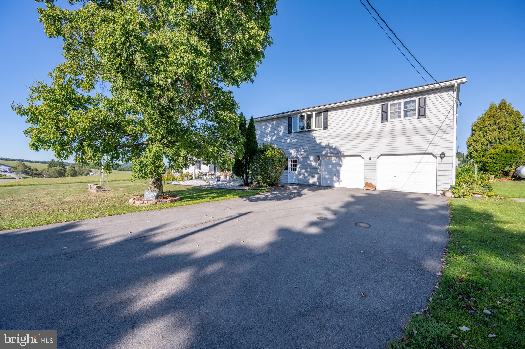 Picture perfect country setting. This spacious home sits on a level lot, in a lovely private setting. You are close enough to town and amenities, but this home offers the quiet country ambiance with a yard ready for fun and games. Multiple living areas and an eat in kitchen make this a perfect family home. This property also boasts two furnaces and two hot water heaters to make everyone comfortable. The two car attached garage and exterior shed means there is plenty of storage for all your toys. Make this home yours today!