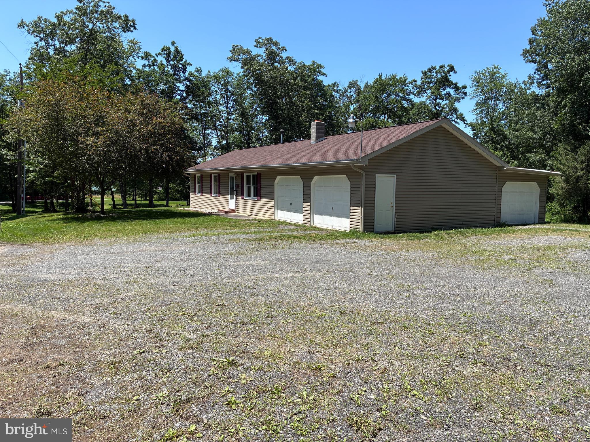 This is an auction property! The auction will take place live at the property on Tuesday, August 12th @ 6:30pm. The price listed is not in any way the sale price and being an auction the property may sell for less or may sell for more on auction day. Home was built in 1999 and has 3 bedrooms, with 1 full bath, approximately 1,404 square ft. of living space and is located in Dickinson Twp. Single story living with 3 overhead garage doors. Home has 3 heating systems. There is a wood stove, which the current owner used to heat the whole house. There is an oil forced air heat system that was barely used, and there is a heat pump. The refrigerator, stove, and microwave convey. There is a crawl space under the house. Home is serviced by well water (250' deep), on site septic, and has a 200 amp electric service. Septic tank was pumped last year. Anyone interested in this opportunity is strongly encouraged to come to one of the open house times and make your plans. Open house dates are: Sunday, July 20th from 1:00-3:00pm, Sunday, August 3rd from 1:00-3:00pm. Buyer pays the 2% state transfer tax at settlement.