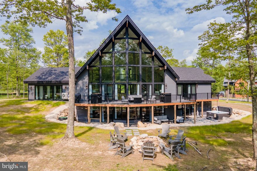 Brand New Mountain Chalet adjoining Lodestone Golf Course - Welcome to Sunset on the Greens. This custom Lindal 7-bedroom, 7-bath chalet is built for luxury mountain living at its finest. Already a proven rental performer, “Sunset on the Greens” grossed over $105k its first six months and all 5 star reviews! The great room steals the show with a towering wall of glass that opens to panoramic views of mountains, lake, and the 13th hole of Lodestone Golf Course. Natural light floods the space, bouncing off sleek finishes and warm timber accents. Step outside to a sprawling deck, hot tub, and fire pit—perfect for epic mountain sunsets. Inside, an indoor pool means year-round fun, rain or shine. The home is loaded with modern comforts: EV charger, gas fireplace, fully finished walk-out basement, and open-concept living designed for gatherings. Every detail was planned to blend style with function. If you’re looking for a stunning retreat with phenomenal rental potential… this home delivers both. Call today for details!