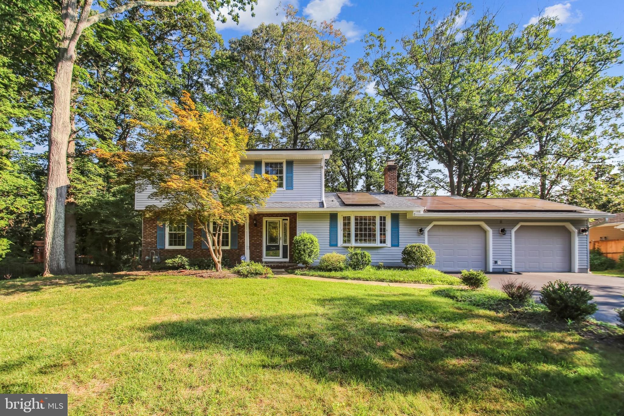 Nestled at the end of a quiet cul-de-sac in the desirable Longmeadow North community in Severna Park, 244 Charita Way offers 140 feet of private waterfront on scenic Cypress Creek. Whether it’s canoeing, kayaking, paddleboarding, or even jet skiing, enjoy direct access to the Magothy River from your own backyard.
This 5-bedroom, 3.5-bath Colonial includes two spacious Primary Suites—one on the main level and one upstairs—each with ensuite baths and walk-in showers. Ideal for multi-generational living or long-term guests.
Freshly updated throughout, the home features new carpet in the four upstairs bedrooms and in the ground-floor Bonus Room, refinished hardwood floors, new LVP flooring in the Foyer, and fresh paint throughout. Exterior light fixtures and door hardware have been replaced, and seller-owned solar panels provide energy savings. (Note: Buyer will be required to take over the existing loan for the solar panels.)
The bright and welcoming Foyer leads to a spacious living room with a large bow window, custom built-ins, elegant white brick fireplace, and a hidden firewood storage nook. A glass-paneled door opens to the Bonus Room—perfect for an office, playroom, gym, or even an adjunct dining room (if desired)—with sliding glass doors to the rear deck.
The modern Kitchen is equipped with stainless steel appliances, quartz countertops with a backsplash, a 3-seat breakfast bar, plenty of cabinetry, and a wall-mounted TV hookup. A matching free-standing wooden storage unit and oversized pantry provide ample space for groceries as well as pots, pans, dishes, and glasses. Sliding glass doors open to a two-tier deck, with views to the water down the wooded hill.
The main-level Primary Suite, created in 2017, is large enough to accommodate a king-sized bed and two bedside tables and includes a walk-in closet with a top all-around shelf, ensuite bath with a glass shower with a fold-down seat, and grab bars for added accessibility. Upstairs, a second Primary Suite joins three additional bedrooms and a full hall bath with shower/bathtub.
Downstairs, the finished Basement includes a Family Room with a brick fireplace, LED lighting, built-in bookshelves, and a Wi-Fi nook closet. The Utility Room houses the Carrier HVAC, Aprilaire humidifier, and a Frigidaire refrigerator (as-is).
The two-car garage features plenty of wall shelving and a full workshop area. Outside, the 0.45-acre lot is professionally landscaped with mature trees and includes a spacious storage shed and an almost-new Generac Guardian 22-kW generator. Enjoy peaceful moments on the deck watching ducks float by or listening to the chimes of nearby St. John the Evangelist Church quietly ringing in the distance on the hour and half-hour.
Includes a one-year home warranty. For those seeking more involvement with the community, there is a voluntary homeowner's association - Cypress Improvement Association, or CIA - with $75 voluntary dues that also offers access to its private CIA pier, wading area, and picnic tables at the very end of Cypress Creek Rd. and sponsors several social activities throughout the year that are meant to pull the whole Cypress Creek area together more closely. This house is move-in ready with plenty of space, many updates, and waterfront serenity—schedule your private showing today.