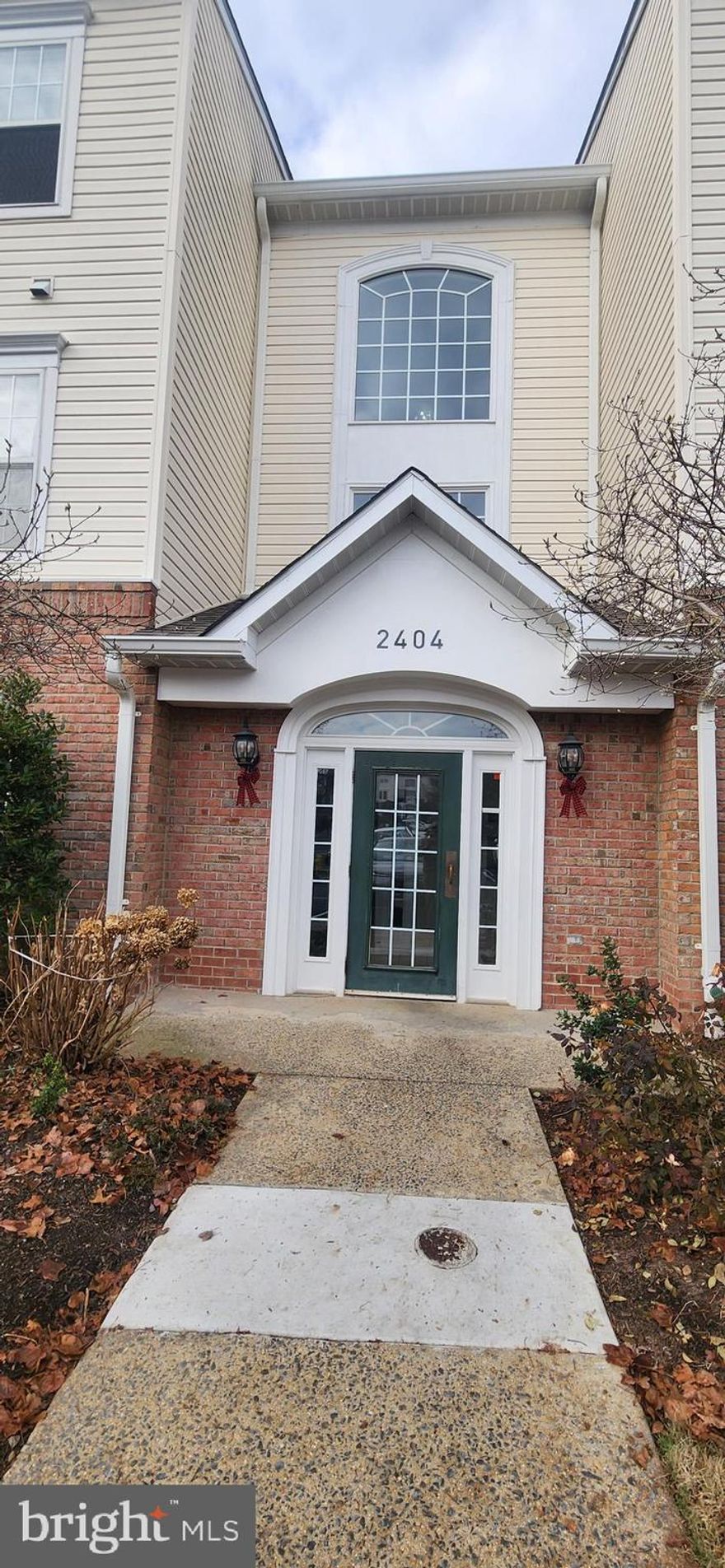 Must See Spacious 2Bdrm 2Full Baths Main Level Condo is in the sought after Gated Community of Chestnut Terrace in Piney Orchard.  Please remove shoes or use the shoe covers provided as you walk on the beautiful, recently installed wood flooring.  The stand-alone fireplace in the large living room conveys.  Eat at the granite kitchen countertop or in the dining room, which leads to the private covered patio.   The foyer has a coat closet and an even larger closet for storage.  There's plenty of cabinets, counter space, laundry closet and a pantry in the kitchen.  The LG washer with its extra-large tub and the LG Dishwasher have built in Wi-Fi and play a musical sound when complete.  Bedroom 2 allows direct access to the common bath with shower in full tub.  The master suite with its ceiling fan has large walk-in dual closets, double vanity sinks and a stand-alone shower.  Community Center, Pools, Shopping Center with restaurants, supermarket etc., nearby.   MARC train, NSA, Ft Meade, Annapolis and DC just minutes away.