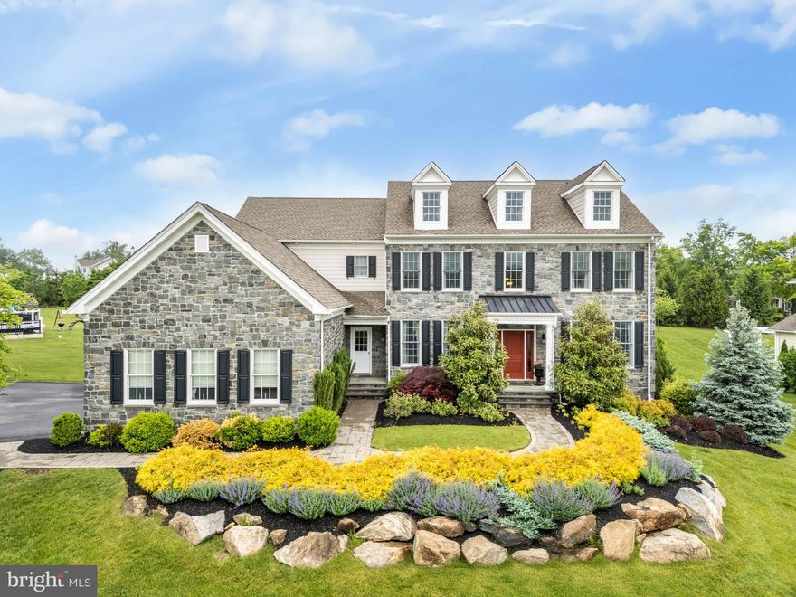 With all the best that Liseter has to offer, and so much more, this 4 bedroom 3.2 bath extended Chelsea model with $800,000 in upgrades and extras on a quiet, beautifully landscaped lot is a must-see! From the stone pathway, enter the magnificent 2-story foyer, and take in the turned staircase, upgraded hardwood flooring and lovely mill work, including extensive wainscoting and multi-piece crown molding. On your left is the splendid dining room with a chandelier-studded tray ceiling extended for better furniture placement, while on your right is the living room with its own wainscoting and sparkling chandelier. Continue on to the rest of large, open downstairs, which offers a step-down family room with gas fireplace. The family room extends to the breakfast area and on to the expanded island kitchen with over-island pendant lighting, Century cabinetry, stainless steel appliances, granite counter tops and a lovely palladian window. The kitchen is easily accessed from the 3-car garage with overhead storage, or from either of the 2 mudrooms, one that enters from the front of the home, and the other with great built-ins that was added from the driveway. Completing the downstairs is an office with french doors on 2 sides, a gorgeous, high-ceilinged sunroom with a palladian window and French doors opening into the family room, a powder room and hall closet. Both the family room and the breakfast area have doors that exit to the multi-tiered deck with pergolas and outdoor appliances, and a stone patio with fire pit was later added to even further enhance the serene back yard. Up the turned staircase is the expansive primary bedroom. Among its most notable features is a sitting room with a marble-topped coffee station, an attached laundry room/dressing area, and a massive main closet with center island. Remote-controlled blackout shades contribute to the room's privacy and peacefulness. The primary bath incorporates an impressive walk-in multi-shower system, as beautiful as it is functional, whose operation and temperature are controlled from an electronic wall panel. The shower anchors the room, while each side of the bath has its own wall-length, mirrored vanity and separate toilet closet. The upper level includes an additional en suite bedroom with a full tiled bath with tub/shower combo, and two additional bedrooms that share a double-sink vanity jack-and-jill bath. A landing with linen closet, hardwood floors and a back stairway to the kitchen/mudroom area complete the upper level. The walk-out lower level, made for fun, is a real treat! Golfers or aspiring golfers in your sphere will love the full-swing golf simulator at one end of this level, which doubles as a wall-sized TV, while the movie buffs will delight in the theater seating large-screen TV viewing at the other end. The area in between offers a u-shaped bar with lots of seating, temperature-controlled wine storage, and a pool table for game enthusiasts. Those taking a break from the fun can relax in the seating area. This level also includes mechanical and storage rooms, 2 closets and a powder room. Control any of the home media, lighting, sound and temperature from the matrix audio-video system panels throughout the home. A whole house generator will keep everything working. Part of the Liseter community, this home, with its high-end upgrades and craftsmanship, also benefits from Liseter's many offerings, including the clubhouse, carriage barn, swimming pool, gym, sports courts and walking trails, along with an outstanding location convenient to highways, schools, dining and shopping. A true gem!