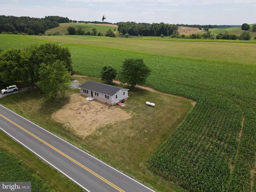 Welcome to 8318 Woodville Rd! This rancher for rent sits on about half an acre and is surrounded by farmland in a beautiful country setting.  Enjoy on the main level this nicely updated home with three bedrooms, a full bath with tub shower, living room, kitchen, and dining room. Off the dining room is access to the backyard patio. Interior access to the full basement is off the kitchen and has a laundry area with a full sized washer & dryer and storage area.  Central air with cold a/c and forced hot air, fresh paint, and stylish vinyl floors through out.  Large driveway with great parking. Small dog okay, no cats.