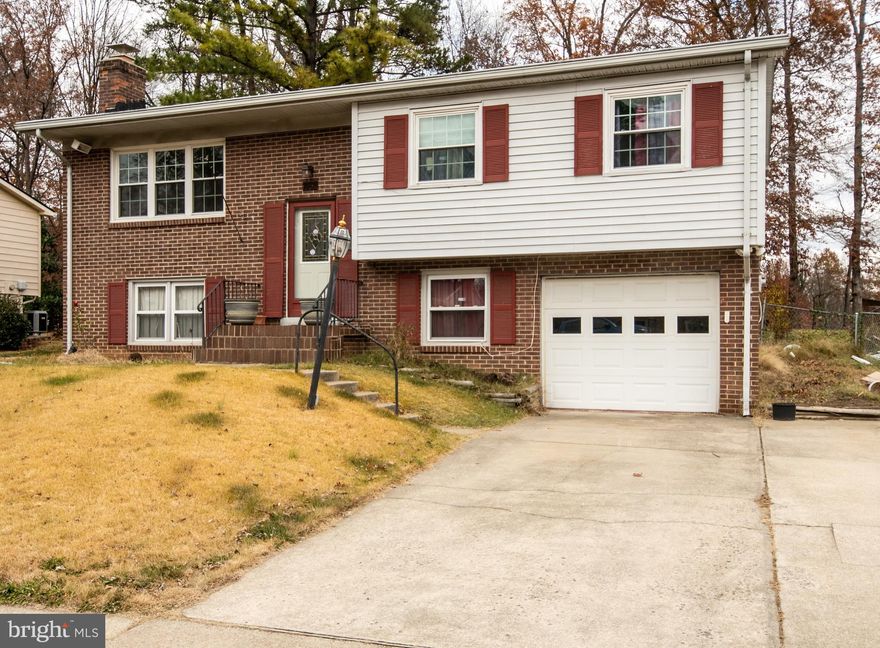 Well maintained single-family home, 4 bedrooms, 3 bathrooms with a prime location. Within 3 miles of I-95, Potomac Mills Mall, and Stonebridge Town Center. The main level bathroom And master bedroom have attached full bath. Carpet throughout the first floor. Bountiful backyard for all your outdoor parties. Extended driveway parking to accommodate 4 or more vehicles. The lower level has 1 bedroom, full bath, large den, spacious rec room with a gas burning brick fireplace. The home has gas cooking, heating, and hot water. Within walking distance to public transportation, commuter lot, shopping, and dining. House has a garage. Owner daughter work from home. Just knock on the door and show it. Need arent back for mone month. The owner just reduced 20.000  to sell quickly.