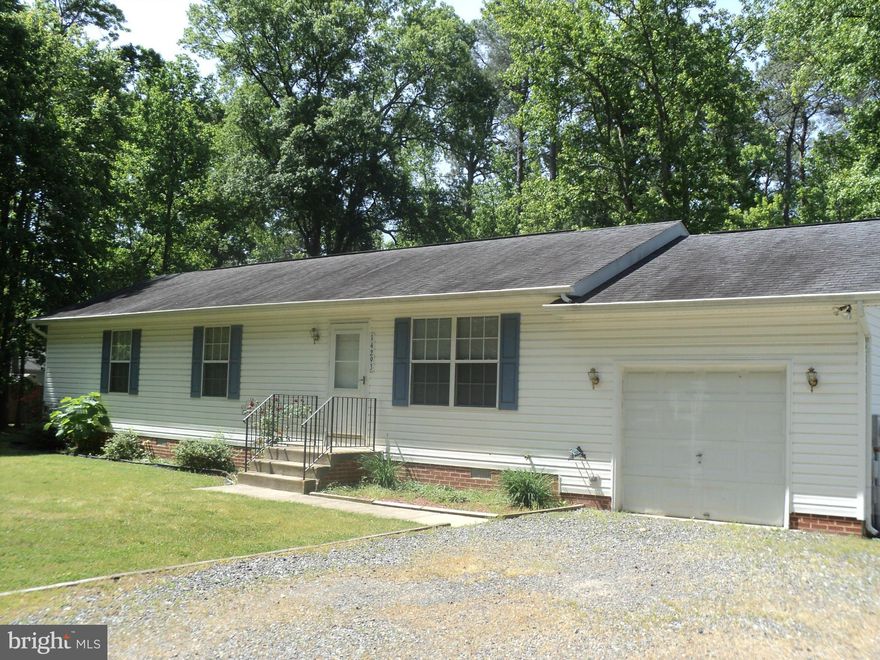 Neat and clean 3 bedroom, 2 bath rambler on large lot with attached garage.  Master bedroom has full attached bath and a walk-in closet.  Second bedroom has walk-in closet also.  All bedrooms have ceiling fans too!  Sit in the lovely backyard with large shade trees and a deck.  Move in just in time to enjoy island living with waterfront, restaurants, marinas, playground and more.