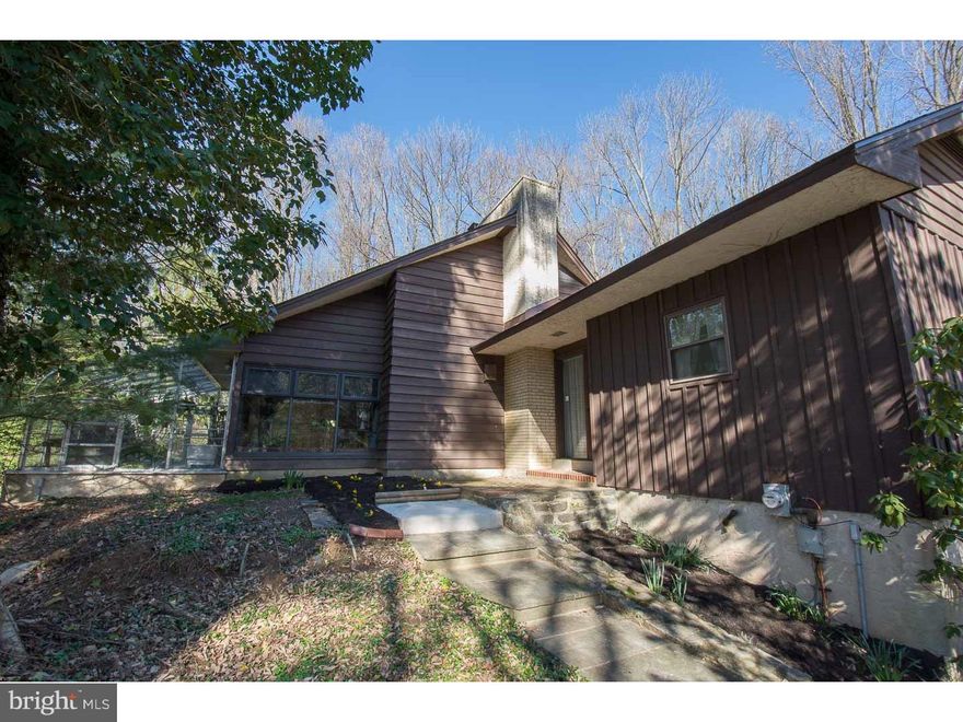 You probably haven't had the pleasure of seeing a house like this one. Located on a 2 acre wooded lot on the corner of a small cul-de-sac street, it offers both privacy and convenience in "low taxes" Thornbury Township. The house is mainly on one level-except for a Loft with access to a huge Attic for storage. The house was designed to take advantage of the beautiful outside views. There are large windows off the Living Room and Dining Area and a working Greenhouse with it's own separate heat and water source attached in the front and a screened-in Porch in the back. The working Greenhouse could easily be enjoyed as a Sun Room if you don't have a green thumb! The Kitchen is a long, galley style with cabinets and counter space galore ending in an open area that could be kept casual or used as a formal Dining Room. There are two Bedrooms with a full Bath at one end of the house and the 3rd Bedroom with it's own sink area at the other. The upstairs Loft overlooks the Living Room and would make a great Office or Den. The owner has lovingly maintained the home and did a pre-listing home inspection correcting all the major issues that were revealed. The roof was replaced in 2014 and the Bathroom was remodeled that year as well. Seller is also offering a 1 year home warranty.