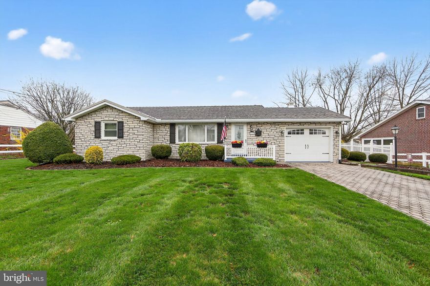 Welcome to this charming ranch home offering classic character and versatile living space, all set on a well-maintained lot with excellent curb appeal. A well-manicured lawn and attractive paver driveway create a warm first impression as you arrive. 

Step inside through the front door into a cozy living room, where graceful arched doorways add architectural charm. To the left, you’ll find three comfortable, carpeted bedrooms and a full bath featuring a walk-in shower. One bedroom includes a ceiling fan, while another offers flexible use - perfect as a sitting room, den, or home office - with convenient access to the kitchen. Straight ahead, the eat-in kitchen provides a functional layout with direct access to the attached one-car garage and stairs leading to the finished lower level. Just off the kitchen, a standout sunroom invites you to relax year-round, showcasing a brick accent wall, paneled ceiling, wall-to-wall windows, and fireplace. This light-filled space opens to the backyard, making it ideal for both everyday living and entertaining. 

The finished lower level expands your living space with a spacious family room featuring carpet, stone accent walls, ceiling fans, and unique built-in two-sided shelving that adds both character and separation. An additional room offers flexibility for a home office, gym, or hobby space. You’ll also find a generously sized full bath with a walk-in shower and sitting area. 

Outdoors, enjoy a large, tree-lined backyard designed for entertaining, complete with expansive hardscaping and a storage shed.