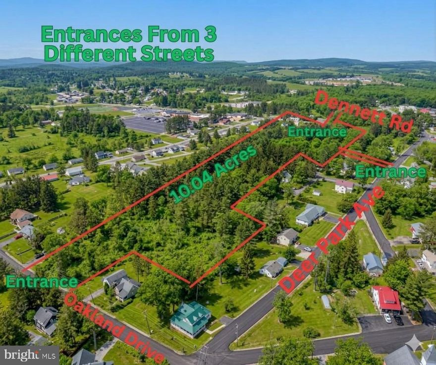 Over 10 acres ready for developing off Dennett Rd. and Oakland Ave. Can be subdivided or could be large parcel to build your dream home, privacy off main streets with 3 separate entrances connecting to town roads.  Engineered drawings for subdivision with grading permit in place at time of survey, is available and will be transferred with sale. (Potential up to 20 lots)  Public sewar & water can be connected from streets.   No roadway through the property, entrances are cleared. Raw land.   Could subdivided or plenty of space for you to build your own unique home with acreage in town limits! Call for more details.