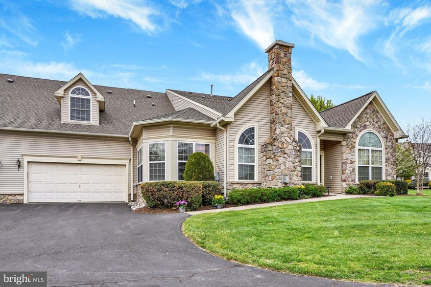 Welcome to the sought-after Villas at Five Ponds, an active 55+ community offering resort-style living. This beautifully upgraded Willow model is truly special, featuring step-free entry with a walkway that leads directly to the front door—an intentional upgrade by the owners for ease, accessibility, and everyday convenience.
Inside, the home was thoughtfully designed by the original owner and showcases quality finishes throughout. The main level features high-quality engineered hardwood flooring and an inviting open layout. The extended breakfast room is a standout, with a vaulted ceiling and two walls of windows that fill the space with natural light. The kitchen is both stylish and functional, offering upgraded cabinetry, granite countertops, and a tile backsplash.
The living room makes a striking impression with a floor-to-ceiling stone fireplace and elegant arched windows, creating a warm and welcoming focal point.
The main level includes two bedrooms and two full bathrooms, along with a versatile den featuring French doors that open to an oversized brick patio with an electric awning—perfect for relaxing or entertaining. The spacious main suite offers a bay window, two walk-in closets, and a luxurious bathroom complete with a jacuzzi tub and a no-curb (zero-entry) shower.
Upstairs, you’ll find a third bedroom or flexible living space with a full bathroom, plus a large finished storage room and additional closet space—ideal for guests, hobbies, or a private retreat.
A two-car garage with an enclosed storage area adds even more storage and convenience.
Residents of Five Ponds enjoy exceptional, resort-style amenities including a clubhouse, indoor and outdoor pools, tennis courts, walking paths, a fitness center, library, card and game rooms, a ballroom, and a full calendar of social events and activities.
Located just minutes from shopping and restaurants, a senior center, and directly across from Five Ponds Golf Course. A beautiful home, a vibrant community, and the lifestyle you’ve been waiting for.