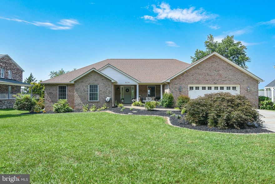 Enjoy year round views of the Potomac River in this custom, all brick, rambler in sought after Potomac Landing.  Professionally landscaped, front to back, you'll notice the pride in ownership the second you pull in. Enjoy a cup of coffee on your front porch, a morning jog down to the community owned water front, or evening cruise around the neighborhood in your golf cart.  Once inside: vaulted & trayed ceilings highlight the open and airy floorplan.  LVP & tile flooring throughout.  Granite counters, 42" cabinetry, like new stainless steel appliances & separate wine fridge make up the exquisite kitchen.  Tastefully painted and decorated throughout - HGTV has absolutely nothing on these sellers!  The flat back yards comes fully fenced with a huge rear patio.  Come see the difference between ho-hum and WOW!  A must see!