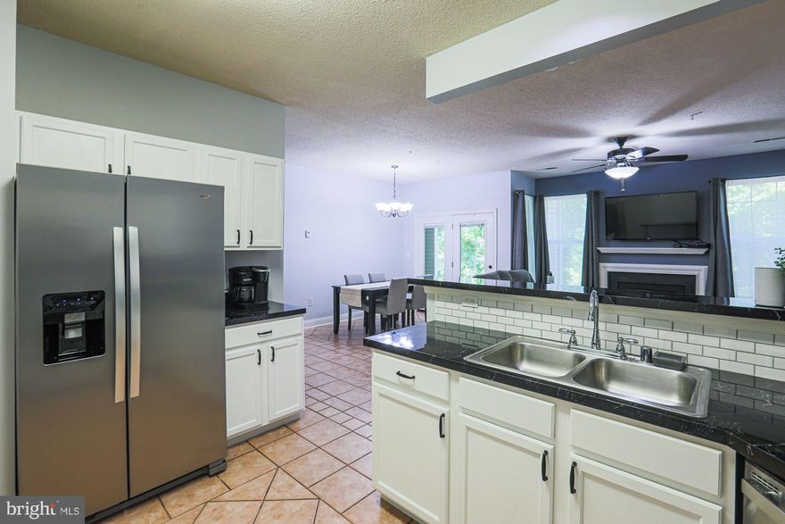 Bring your things and get ready to move into this bright and airy, well maintained ground level condominium!  Featuring over 1200 sqft, three bedrooms, two full bathrooms, a large private patio backing to a wooded area and an attached 1 car garage- perfect for convenience, as well as inclement weather( there is also AMPLE parking onsite for your family & friend to visit). Offering a secure entrance, this home has a large, open floor plan with a gas fireplace, tons of natural light and eat-in kitchen with breakfast bar, spacious primary bedroom with oversized soaking tub, and huge walk-in closet. Two additional bedrooms on the opposite side of the unit, along with the hall bathroom. A full size washer and dryer are also included, completing this beautiful property.  Following items have been replaced in 2021: refrigerator, dishwasher, dryer, and 2 new toilets. 

Close to Shopping, Entertainment, Major transit and highways . Must see this home- will not last... Schedule to see today!