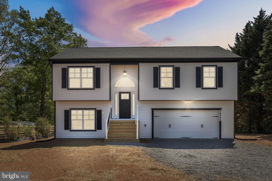 Discover the charm of this exquisite split foyer home, a masterpiece of modern design completed in 2026. With 4 spacious bedrooms and 3 full bathrooms, this residence boasts an open floor plan that seamlessly connects the family room and kitchen, perfect for gatherings. The kitchen features quartz countertops, an island, and stainless steel appliances, making it a culinary delight. Step outside to enjoy the serene lot, spanning nearly an acre and backing to lush trees, providing a tranquil retreat. The exterior is adorned with inviting porch spaces and thoughtful lighting, enhancing the home's curb appeal. Inside, enjoy luxurious finishes like ceramic tile and luxury vinyl plank flooring, along with cozy carpeting in the bedrooms. The fully finished basement offers ample natural light and convenient access to the attached garage. With modern security features and a layout designed for comfort, this home is a perfect blend of craftsmanship and contemporary living. Embrace the opportunity to make this unique property your own!