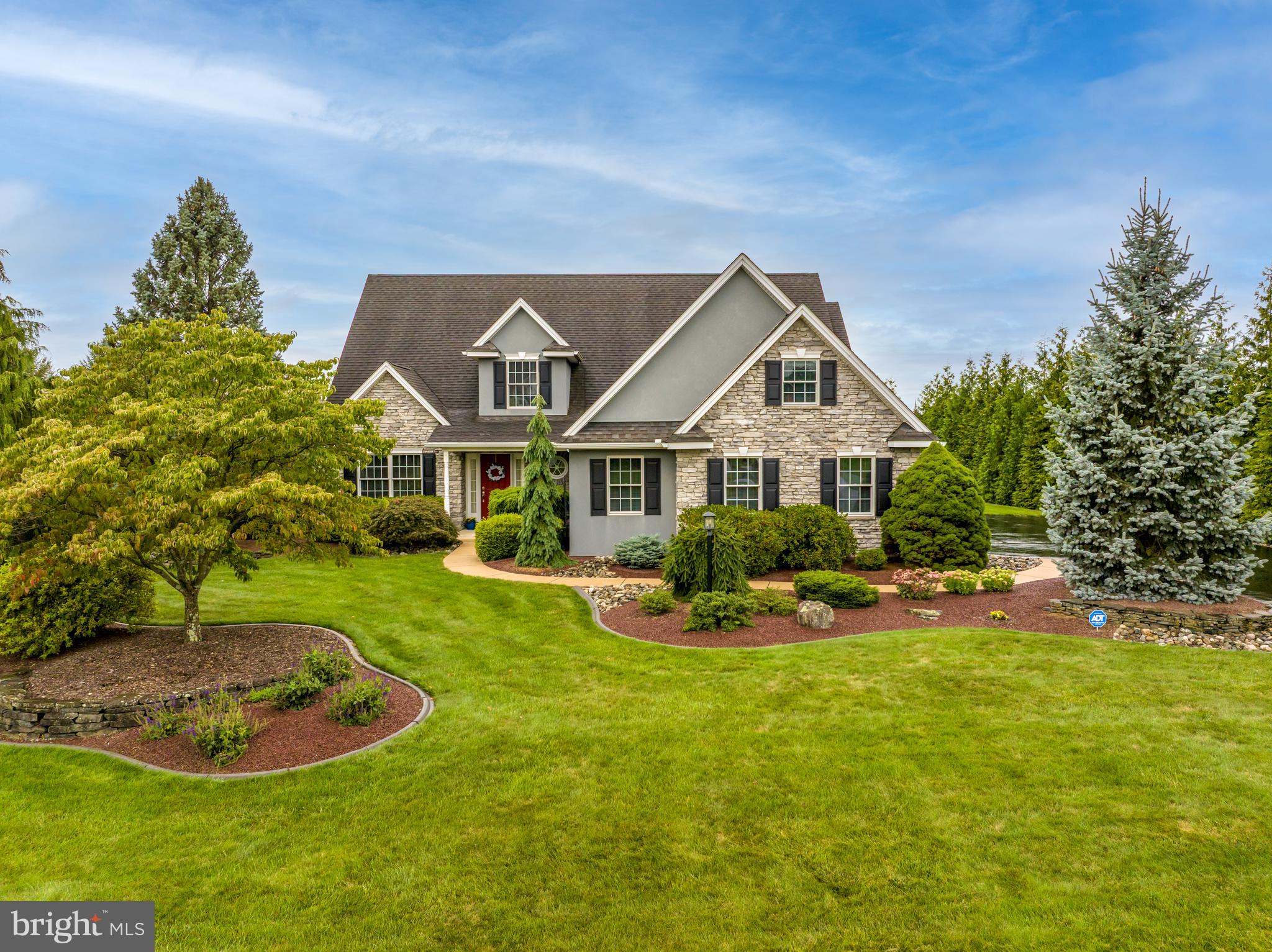 Welcome to this stunning 3,000+ SF Cape Cod style home in Fairland Farms, a sought-after Curtis Schneck–built neighborhood within the Parkland SD. Impeccably maintained, this home offers 4 Bedrooms & 2.5 Baths, including a 1st flr Primary Suite. Step inside the spacious Foyer with gleaming HW flrs & a view of the formal Dining Room, ideal for entertaining. The Kitchen boasts an abundance of cherry cabinetry, quartz countertops, stainless appliances, & peninsula seating, with an adjoining Breakfast area overlooking the patio and backyard through the sliding door. The Great Room is a showstopper—open to the 2nd flr with a cathedral ceiling, cozy gas fireplace, & warm w-to-w carpet. From the upstairs catwalk, enjoy a panoramic view of this impressive space. The Primary Suite features a walk-in closet with custom organization and a spa-like Ensuite with a quartz double vanity, glass walk-in shower & separate soaking tub. A Powder Room & Laundry complete the main level. Upstairs, find 3 generous Bedrooms with ample closets. The 3 Bedrooms share a Full Bath with a tub/shower combo. The Basement, plumbed for a bath, offers endless potential for finishing or storage. Outdoor living is equally inviting with a covered patio w/adjacent Blue Stone patio & private backyard. Additional amenities include an unfinished 2nd-flr storage area, oversized 2-car garage & custom concrete curb edging. Experience the perfect blend of comfort and style in this exceptional home. Your dream home awaits!