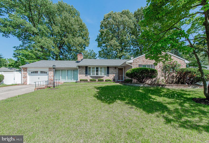 Stunning elegant brick rambler with garage on level cul-de-sac lot. Gleaming hardwoods throughout main level. Remodeled kitchen w/cherry cabinets and neutral counters-room for eat-in kitchen but has formal dining room. Sensational sunroom with crank-out windows and built-in BBQ for fun entertaining-another outside bbq and patio. Freshly painted, new roof, new garage door-fabulous, fenced rear yard, all appliances!