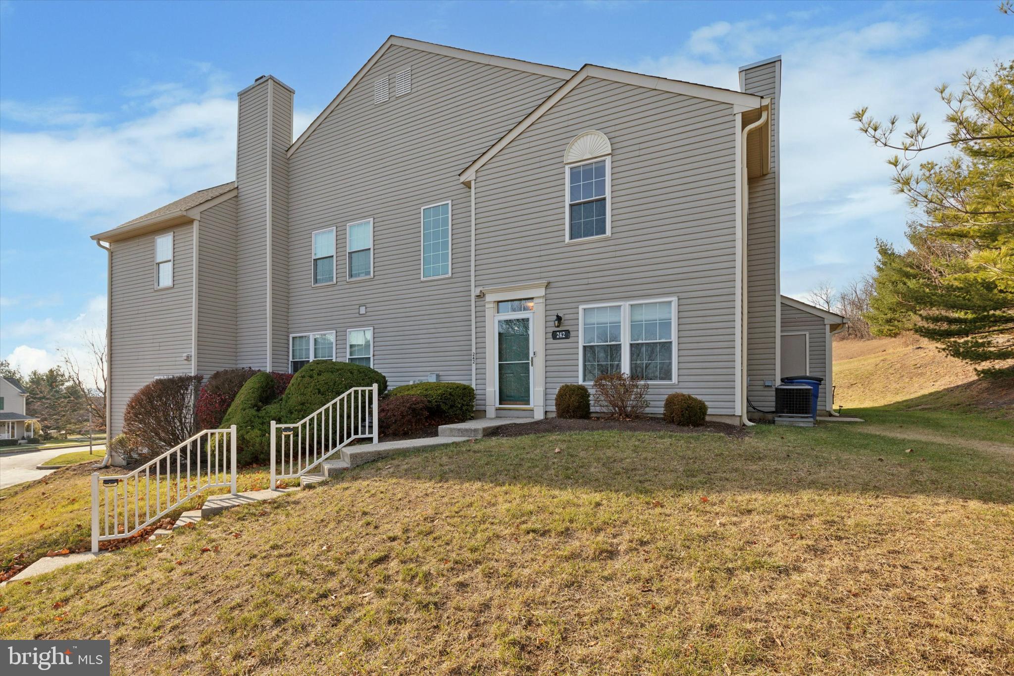 Welcome to 242 Cobblestone Court—a place that feels like home the moment you walk in. This charming, end-unit townhouse in the highly desirable Providence View community offers the perfect balance of comfort, style, and convenience—all within the award-winning Spring-Ford Area School District. Here, you’re just minutes from everything you need—local restaurants, shopping, King of Prussia Mall, Valley Forge National Park, scenic trails, and easy access to major highways. Whether you’re looking for a quiet escape or a fun night out, it’s all right at your fingertips. Step inside to a welcoming foyer with hardwood floors and plenty of storage. The open living and dining area is bright and inviting, complete with a cozy fireplace and sliding glass doors that lead to a little private patio with access to a storage room. The kitchen is designed for both function and style, featuring granite countertops, oak cabinetry, stainless steel appliances, and a spacious pantry. Right off the kitchen, you’ll find the laundry area with a full-size washer and dryer—making everyday living even easier. Upstairs, the primary suite is a true retreat with vaulted ceilings, hardwood floors, a walk-in closet, and a private bath with a granite vanity and oversized shower. The guest bedroom is just as comfortable, with hardwood floors, a large closet, and easy access to the hall bath. As part of Providence View, you’ll enjoy low-maintenance living with exterior care, lawn service, and snow removal all taken care of for you. Plus, community perks like a tennis court, fitness center, and sparkling inground pool make it easy to stay active or just relax close to home. Move right in, unpack, and start enjoying a lifestyle where comfort and convenience come together beautifully.