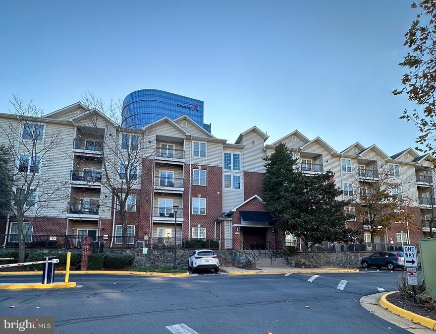 Rarely available TOP FLOOR END UNIT  with building elevator, privacy, views, security, quiet Top Floor relaxation, and numerous amenities in a very convenient location. Resort like living in Mclean! Silver Line Metro is right across the street. 
A fully equipped open kitchen features plenty of counter space, cabinets, space to move around, and a pantry. In-unit laundry is a valuable feature with a full-size washer/dryer.    Natural sunny light in a cheery living/dining combo area off the open kitchen. City evening views are wonderful and attention-grabbing. 
Surprisingly large Bedroom includes a walk-in closet * and a big bathroom right off the hall.  Warmly welcome your guests in the spacious entryway and convenient coat closet.  1521  building is located right across from the Clubhouse, pool, large gym, sauna, heated spa,  and sports courts, tot lots, walking paths, with pet station are located within short distance. EV charging stations available in the community. No need to tour around the community to access major amenities. 1 large end garage space is included plus 2 parking lot tags.   Metro, Wegmans, and Capital 1 Center are right across the street as well.  Tysons Corner, I495, and Dulles Access Rd are close by.