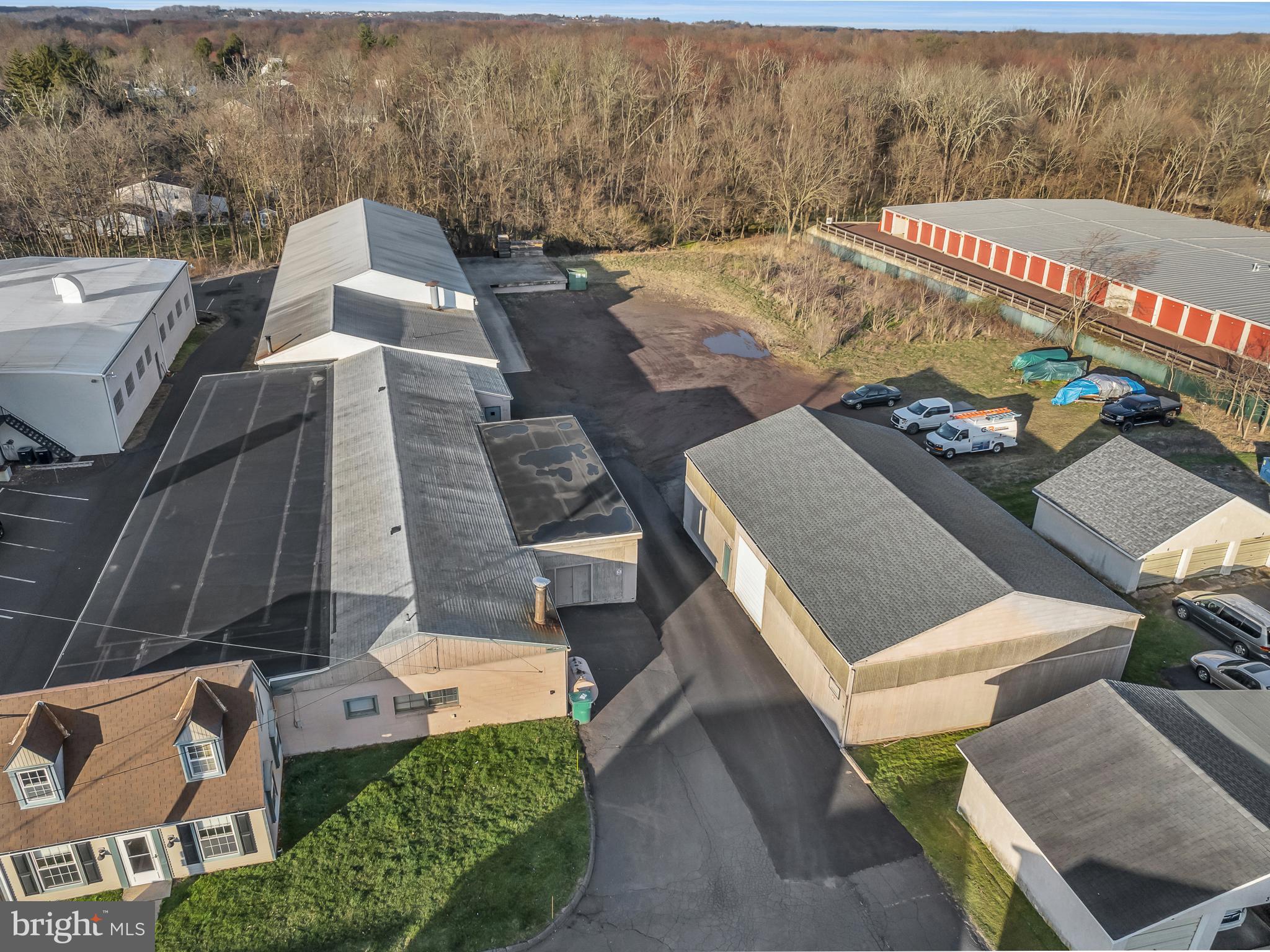 Over 17,000.00 Sqft of building space on approx. 1.7 acre lot. Zoned Industrial for light manufacturing. 600 sqft of office space. 3 half baths. 40% 10.5 foot high ceilings. 60% 13 foot ceilings. 32X18 paint room with OSHA blow out walls and sprinklers. Two 12 foot overhead doors at loading doc. Tractor trailer accessible. Parking could be expanded or an additional building could be built. 50X40 pole building with new roof (2022), concrete floors, 11ft overhead door, and electric.