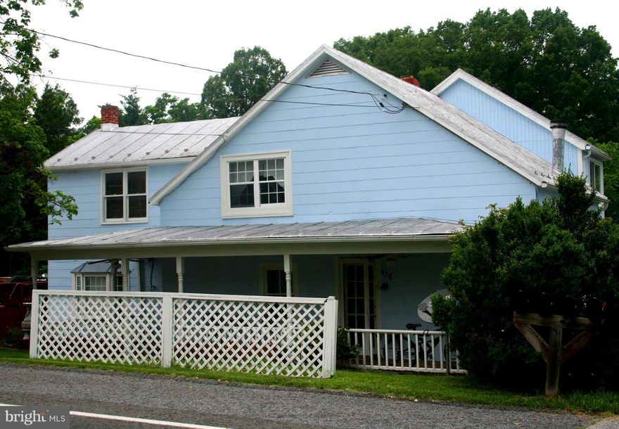 Great opportunity!  Continue to use as an investment with current configuration as two units or easily convert back to single family for more space.  First floor is 2 br, upstairs is 1 br plus den/sunroom.  Adorned with cascading rear porches w/beautiful views, screened room, and artist's studio. Close to everything Luray and Page county have to offer.  Recent rents have topped $1600/month