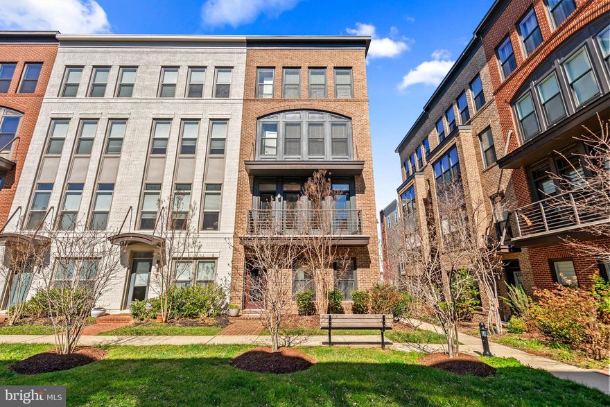 Welcome to your new home!  Four-Level Upgraded END Unit, Modern 2-Car Side by Side Garage 20 Foot Town-home with 4 Bedrooms and 3 Full Baths plus 2 Half Baths.  This Rare Found Home has a beautiful bright Open Floor Plan with lots of Natural Light, Luxury Upgraded Gourmet Kitchen, Balcony, Deck and Rooftop Terrace.  
The Lower Level of this Brick Home features a Den/Office Area with Half Bath plus rough-in plumbing for a Full Bath which could also be the 5th Bedroom or Multi-generation Suite!  2-Car Side by Side Garage on rear opens into the Lower Level.  
Second/Main Level includes almost new Stainless Steel Gourmet Appliances with beautiful oversized Island topped with Quartz Countertops surrounded by unique Backsplash Tiles.  Breakfast Bar opens onto a bright and airy Living Room with a wall of Large Windows and a Deck.  Other side of the Main Level has a Dining Room with Large Windows and walk out to Balcony.  Perfect Home for Entertaining!  
The Upper Level has three generously sized Bedrooms with two Full Baths and the Laundry Area with top-of-the-line Washer and Dryer.  Spacious Owner’s Bath with Double Vanity and beautiful Shower.
Finished 4th/Loft Level has a Recreation Room for entertaining plus the 4th Bedroom/Office with Full Bathroom and a huge Outdoor Terrace.   
Two Zone HVAC.
Freshly Painted and Brand New Flooring with One Year Warranty throughout the Whole House.  
Great Location in King Farm close to Shopping, Restaurants and Medical Centers. 
This Community offers generous Sidewalks, Tot Lots, Dog Walking Areas, Large Parks, Swimming Pools and Free Shuttle Bus to Shady Grove Metro Station. 
Shuttle Bus Stop only few steps from this Home - Perfect for DC Commuters.  
Minutes to Shady Grove Road, Crown and Rio Shopping Centers.  Come see it before its gone!