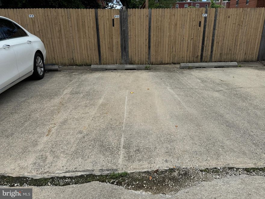 **This listing is ONLY for one assigned parking space.** Secure surface parking space for sale at The Picasso Condominium. Parking space owner does not need to be a resident of the condo building. Previously rented for $175/mo. Parking lot is located off alley between Longfellow St. and Madison St. NW. Access alley from 7th or 8th St. NW.