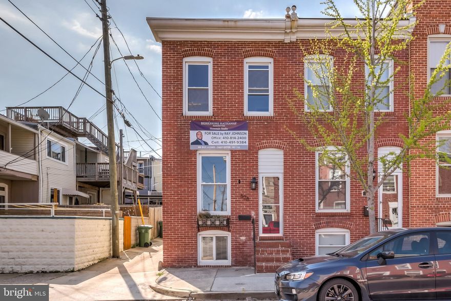 Great opportunity to own an end unit townhouse in Brewers Hill.  Parking pad in rear.  The Interior features a large exposed brick wall, crown molding, and pretty natural light.  Kitchen with stainless steel appliances and table space.  The spacious layout is 13' wide with two large bedrooms. Freshly painted. Unfinished basement with potential for adding additional living space. Conveniently located to I-95, John's Hopkins, Canton Square, and local shops and restaurants.