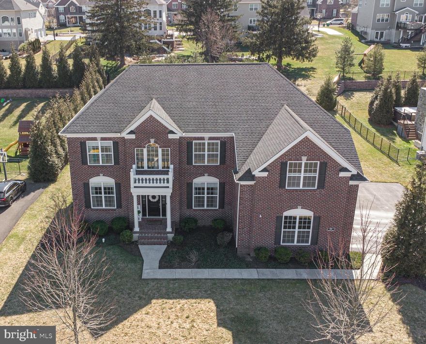 Lavish brick-front home nestled on nearly half an acre in prestigious Horsham Valley Estates . Premier location  in the back of the development, with rain garden water views of community pond and lush woods with hiking trails. This luxurious 5/6 bedroom Duke Williamsburg Model built by Toll Brothers was customized to feature 5 bedrooms, each with their own bathroom, and  a rare 6th bedroom upgrade that is being used as an office.  Convenient first floor bedroom makes a perfect in-law or au pair suite , with access to a full bathroom!  Step into the grand 2-story hardwood foyer with magnificent chandelier that opens to the sundrenched music conservatory with gleaming hardwood floors , chair rail, and crown molding. The expanded great room features glistening Flint Maple hardwoods, gas fireplace with granite hearth, recessed lighting, and  Sonos surround sound system! The chef’s kitchen boasts granite countertops and island, Gypsea glass backsplash, Soft-close dove-tail drawers, Century Avalon cabinets, stainless steel Whirlpool appliances, and a breakfast room with bright sliders to your expansive back yard! The elegant dining room has chair rail and chrown molding, maple hardwood flooring, and contemporary Patina light fixture. The spectacular  primary suite features plush carpeting, recessed lighting, sound system, 2 huge walk-in California closets,  and a luxurious en-suite with double sink, garden soaking tub, beautiful tiled flooring,oversized shower, and water closet ! The remarkable second suite is set up as 2 bedrooms with a  shared bathroom between and closet by design with extra shelving and drawers. The additional lovely bedrooms upstairs each have soft carpets, large closets and/or storage area,  full bathrooms, and views overlooking the pond and walking trails!  No expense was spared, with Carolina beaded siding,  oversized garage, expanded great room, playroom extension, reconfigured primary suite  for larger closets, recessed lighting & designer light fixtures throughout, most outlets are motion sensor night lights, oak main stairs,  reverse osmosis water treatment system with softener,  Sonos surround sound, custom window treatments,  and upgraded second floor plan that is one of a kind in the community! Award-winning Hatboro-Horsham School District!  Over 4100 sq feet of living space, and that does not even include the walk-out basement with roughed-in plumbing and additional 1 ft in height … just waiting to be finished! Conveniently located minutes from the 309, 202 ,611,152, 476, the PA Turnpike, Horsham Rd, Deep Meadow Park, & Talamore Country Club.