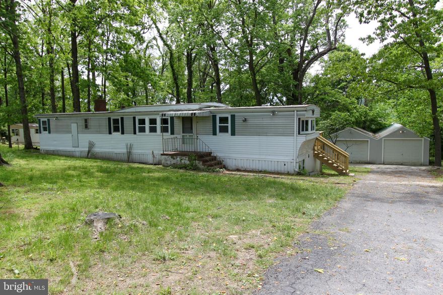 This scenic home offers a cozy, wooded alternative to your suburban average. Located near route 9 and 340, it is an easy commute in a beautiful location. This 2 bedroom 1 bath single wide trailer features a wood stove, one open deck, one enclosed porch, partial fenced in yard, and a 2 car garage. Washer and dryer included. Pets are case by case basis. EHO.Bonus Amenity Included* A portion of the resident's total monthly amount due will be used to have HVAC filters regularly delivered to their doorstep under the Utility & Maintenance Reduction Program.