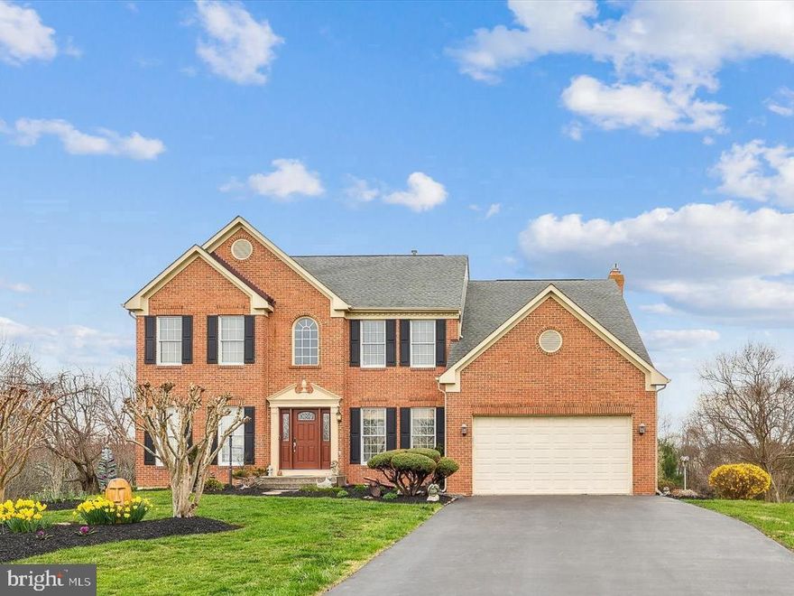 Welcome to this stunning Poolesville home, set on a .81-acre architectural landscaping masterpiece in the heart of Poolesville, a true dream come true! Nestled in a private cul-de-sac and surrounded by expansive lots, this premium classic colonial offers a perfect blend of modern upgrades and timeless charm. With soaring 9-foot ceilings, rich hardwood floors, and a beautifully renovated gourmet kitchen featuring cherry cabinets, granite countertops, and a spacious island, this home is ready for all your culinary adventures.                      
Take in the breathtaking views from the expansive sunroom, flooded with natural light from wall-to-wall windows, or step outside onto the large deck, overlooking a peaceful wooded backyard and private creek your own serene outdoor oasis, ideal for entertaining or simply enjoying nature’s beauty.

Inside, on the main level you will also find the spacious family room with a cozy gas fireplace, an elegant dining room, a home office and a grand two-story foyer make this home feel both open and inviting. Every room is thoughtfully designed. 
Upstairs the luxurious owner’s suite is a peaceful retreat, featuring soaring ceilings, a generous walk-in closet, and a expansive bathroom with double vanities, separate tub and shower. 3 additional sun filled large bedrooms and full bath. 

The finished lower level is perfect for entertaining, offering an expansive bonus game room, media room, or gym. The walk-out basement leads directly to the beautifully landscaped backyard, making the outdoor space easily accessible.