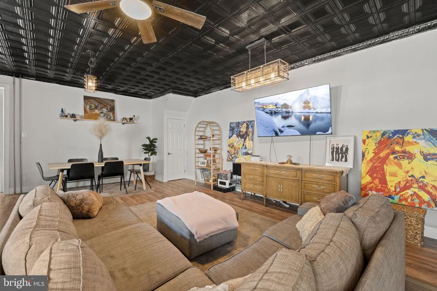 Rarely does a home with this much space, versatility, and opportunity come to market. Welcome to 155 Jamestown Street, a 5-bedroom, 2.5-bath home with two-car parking, offering the perfect blend of comfort, functionality, and room to grow.

Enter from the private driveway into the expansive eat-in kitchen, where generous counter space and an open layout make everyday living effortless and entertaining a joy. Whether you're hosting a lively gathering or enjoying a quiet night in, this space easily adapts to your needs.

Just beyond, the oversized living area offers incredible flexibility. Currently configured to include a formal dining space, it invites you to create the atmosphere that fits your lifestyle. This level seamlessly balances warmth and openness, creating a space that feels both inviting and comfortable for everyday living while still ideal for hosting. A convenient half bath, storage closet, additional outdoor access, and entry to the basement complete this level.

Upstairs, the primary bedroom is filled with natural light thanks to an abundance of windows and features a full wall of closets, offering both comfort and practicality. Two additional bedrooms and a full bath complete this floor.

The top level introduces even more flexibility with a spacious loft area and two additional bedrooms, along with a second full bath. Currently enjoyed as a playroom, office, guest space, and music area, this level offers endless possibilities to suit your evolving needs. From here, take in views of the city that remind you just how close you are to it all.

The basement presents an exciting opportunity for future finishing, whether you envision a home gym, media room, or additional living space.

Location truly sets this home apart. Just moments from downtown Manayunk, you’re a short walk to a vibrant mix of restaurants, shops, and nightlife, along with access to some of the area’s most beloved outdoor spaces, including the Schuylkill River Trail, Manayunk Canal Towpath, Wissahickon Valley Park, and Tyler Arboretum.

A home with this much space, flexibility, and location is truly a rare find.