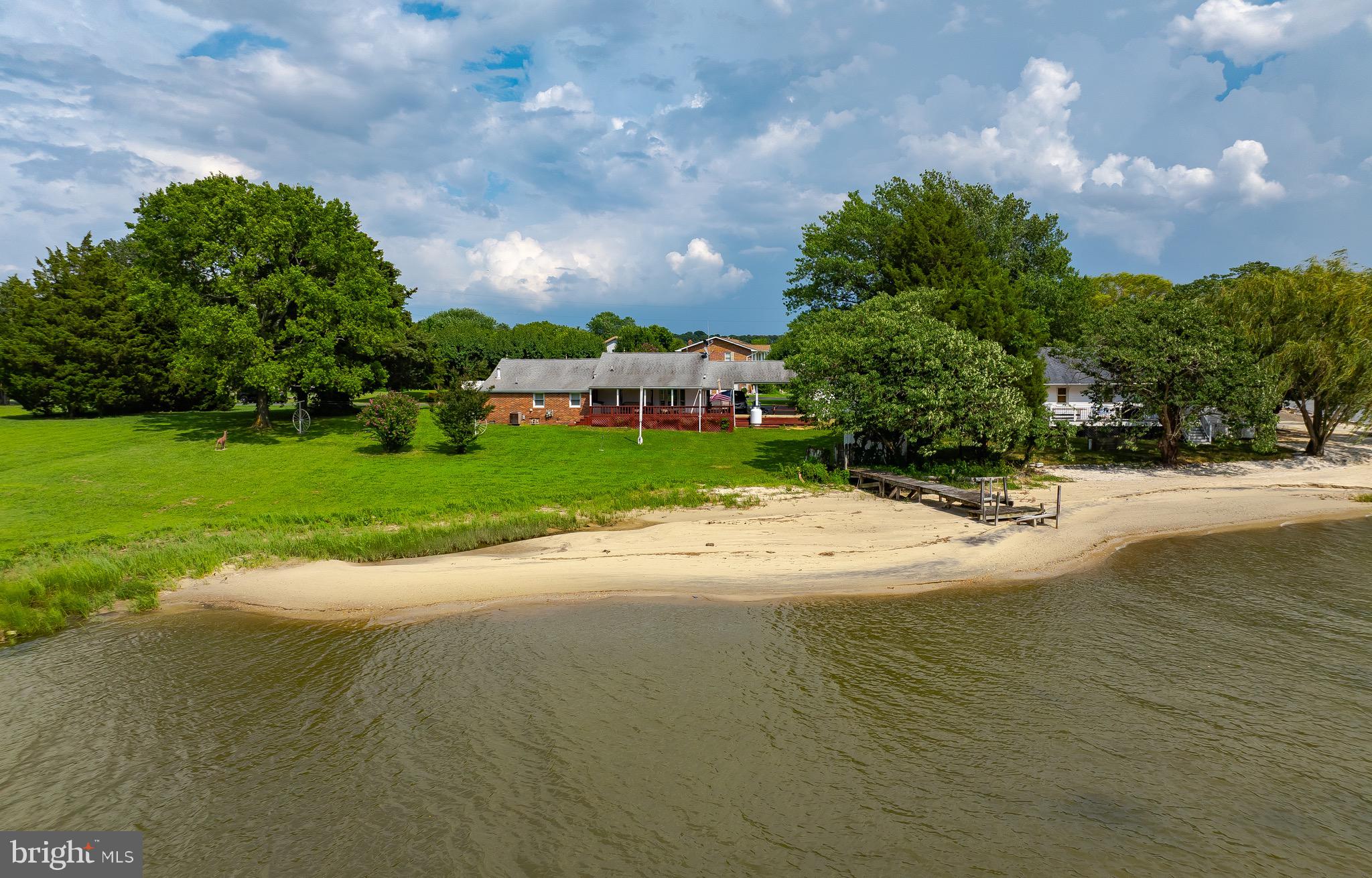 Welcome to Bowles Road Your Private Waterfront Retreat!
Nestled on .85 acres of serene, natural beauty, this special property offers a rare opportunity to enjoy a true beachfront lifestyle. From the moment you arrive, you’re surrounded by nature and tranquility. Throughout the seasons, you’ll witness an abundance of wildlife right in your backyard – from graceful bald eagles and osprey to deer, geese, and countless other native species that call this area home.
Step out onto your deck and take in the sights and sounds of the Potomac River. Spend your evenings gazing at the stars and listening to the gentle lapping of the water as you unwind from the day. This is more than a home….it’s an experience.
The current owner has cherished this property since 1998 and has loved every moment of life here. Inside, you’ll find a spacious 23’ x 24’ family room that provides ample space for friends and family to gather and make memories.
Step down to the water and experience the beauty and versatility of this ever-changing beach. The shoreline shifts with the tides, providing a unique and dynamic waterfront view every day. Launch a canoe, kayak, or stand-up paddleboard right from your beach and glide out onto the Potomac River. If fishing is your passion, you’ll be delighted to know that the perch are plentiful and ready for your next catch!
Whether you’re seeking a quiet place to relax, a space for water sports, or a serene spot to watch the stars dance across the sky, this property has it all. Come experience the best of waterfront living at Bowles Road, where every day feels like a vacation!