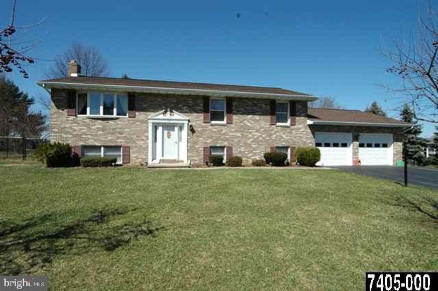 Quality built Doug Ward home in New Freedom. 4 BR, 3 FB w/huge remodeled E/I kitchen/dining area w/island, gas range, pantry, lam floors & patio doors to lovely landscaped, newly fenced in backyard. 3 BRs & 2 FBA on main level. Large FR on LL w/wood stove & 4th BR w/FBA.  Newer roof, A/C, H/W Htr, fridge & humidifier.  A MUST SEE!