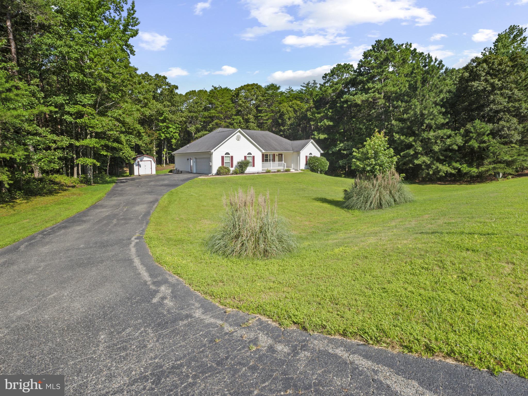 Welcome to the quiet neighborhood in Forest Farms within Hollywood MD. 23293 Nicholson St is also mapped in the beloved Leonardtown school district. Other local features is the close proximity to the River Naval base. Surrounded by Scenic Forest Farms, this is a prime location with over 2 acres of wooded picturesque view. You have land to make it what you want.
Step into this inviting home designed for a retreat in a desirable community. This modern ranch rambler features an open-concept layout with three bedrooms and two full bathrooms conveniently located on the main level. Just off the entrance, you'll find a cozy library nook or separate sitting space, perfect for enjoying quality time reading or chatting with friends. The focal point of the living area is the striking fireplace. The kitchen boasts bright open space with cabinets reaching the ceiling, a closet pantry, and stainless steel appliances. Adjacent to the kitchen, French double doors lead to a magnificent sunroom adorned with cathedral ceilings and Palladian windows that offer stunning views of the surrounding forest farms. Laundry can be done on the main level for your convenience. The master bedroom is generously sized, featuring his and her closets, along with a well-designed bathroom that provides ample space for personalization. The lower level offers an ideal rec room, workshop, or gym area, along with two guest bedrooms, a full bathroom, an extra laundry hookup, and convenient walk-up exit access.