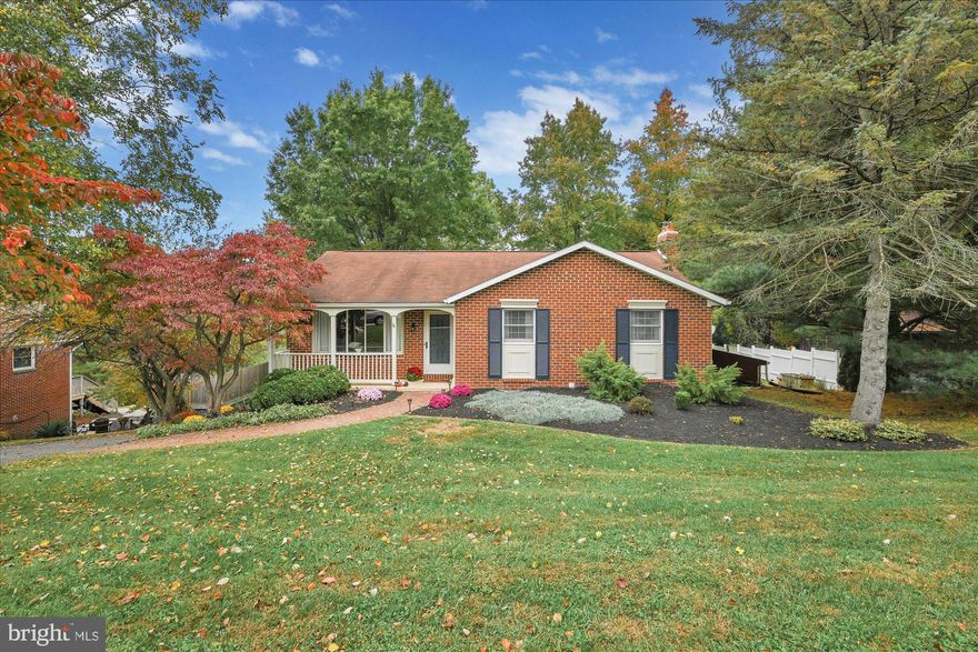 Looking for a beautifully maintained home on a quiet street in Dallastown School District? Look no further! This gorgeous 3 bedroom 1.5 bath Ranch style brick home is move in ready.  This home is walking distance to Lake Williams, Nixon Park nature center, and multiple hiking trails. Have to commute? This home is only minutes from Rt 83. When you are ready to relax you can chill by the wood fire pit in the back yard or under the covered patio while watching TV. The 2 car garage below is climate controlled and has added cabinets for plenty of extra storage. This home features stainless steel appliances, hardwood floors in the living room & kitchen, a finished basement with a wood burning stove insert and a half bath in the basement. Don't let this amazing one level living home slip away! Book your tour today!