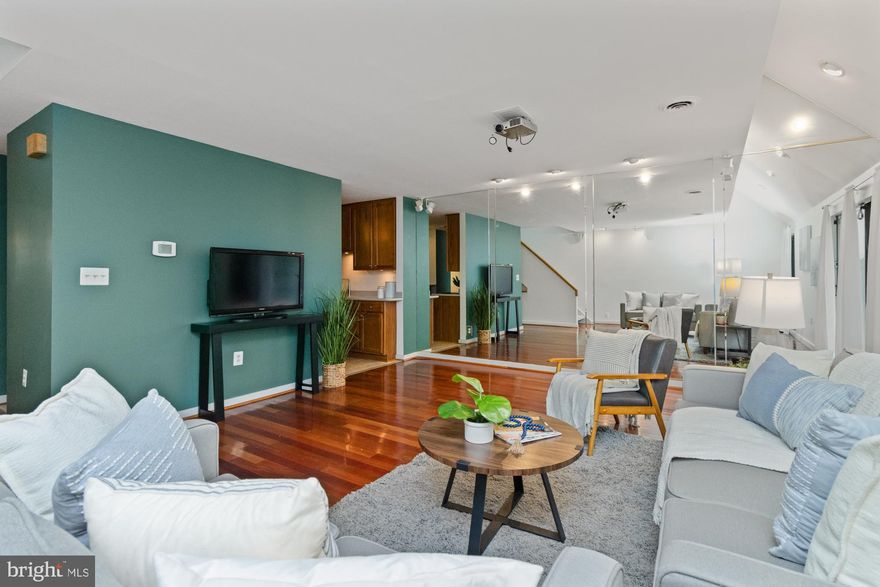 Welcome to one of the largest residences in the highly desirable Coldspring Newtown Condominium community, offering a unique blend of style, space, and convenience. Designed by world-renowned architect Moshe Safdie, this “deck house” style home stands out for its striking modern architecture and walkable, park-like setting. This spacious 3-bedroom, 2.5-bath home has been beautifully updated and is filled with natural light from its oversized windows. Brand new hardwood floors that extend through the living and dining areas, creating a warm and inviting flow. Charming brick patio off of living room to fully fenced yard.
The thoughtfully updated eat-in kitchen features Corian countertops, stainless steel appliances, peninsula, breakfast nook, and a dry bar—ideal for the chef in the family and perfect for gatherings. Much larger than most kitchen designs in the community. Half bath on the entry level.
Upper level includes a primary suite with an en-suite bath and walk-in closet. Cherry floors run throughout the upper level, adding timeless style. Two additional spacious bedrooms and hall bath complete the upper level. 
The lower level provides direct access to covered TWO CAR parking, a laundry room, and additional storage.
Coldspring Newtown takes the stress out of homeownership—the condo fee covers roof, exterior, water, sewer, trash, pool access, grounds maintenance, porter service, snow removal, landscaping, and more. Residents also enjoy lush green spaces, playgrounds, and winding walking paths throughout the community.

This is a rare opportunity to own one of the largest and most desirable units in Coldspring Newtown—move right in and experience modern design, low-maintenance living, and a vibrant community lifestyle.