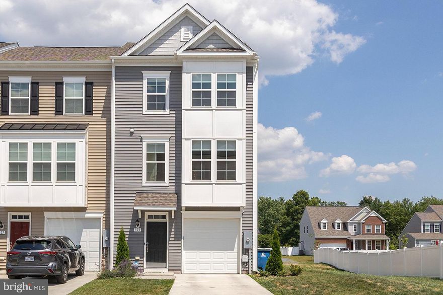 Beautiful, Like New (2021) End Unit Townhome in Winchester.  The large Open Floor Plan on Main Level features an Upgraded Gourmet Kitchen with Large Center Island, Quartz Countertops, Stainless Steel Appliances, Subway Tile Backsplash, Upgraded Lighting Package, and Luxury Vinyl Plank Flooring.  Family and Dining Rooms off Kitchen. Upgraded Carpet and Padding in the Family room. Large Deck off Kitchen.  Spacious Primary Suite, Large Walk-In Closet, Primary Bath with both Shower and Soaking Tub, and Double Vanity. Two Additional Bedrooms up,  including one with LVP. Stackable Miele Washer and Dryer Package also on the Upper Level. Large Fully Finished Rec Room with Full Bath and Walkout. Added Barn Door allows for a "Mini-Suite" if Desired. One Car Garage with Epoxy Sealed Flooring. WIFI enabled Locks. Nest Thermostat. This Home is 100% Turn-Key Ready.