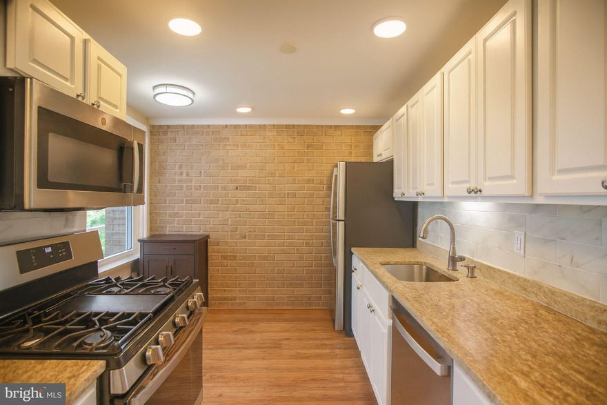 This well-maintained 2-bedroom, 1-bath condo in Huntley Square offers a practical layout with a touch of modern charm!! Large windows fill the living area and bedrooms with natural light, giving the space a bright, welcoming feel. The kitchen includes granite countertops, a tile backsplash, and updated appliances that make daily living easy and efficient. The open living and dining area leads to a private balcony through sliding glass doors, perfect for a bit of fresh air or a quiet morning coffee. Both bedrooms are carpeted for comfort and feature good closet space, while the bathroom has been refreshed with ceramic tile and updated fixtures. A convenient in-unit washer and dryer add to the home’s everyday ease. Located near major commuter routes, shopping, and parks, this condo is ideal for anyone seeking affordable, low-maintenance living in a convenient Temple Hills location. Condo fee includes all utilities.