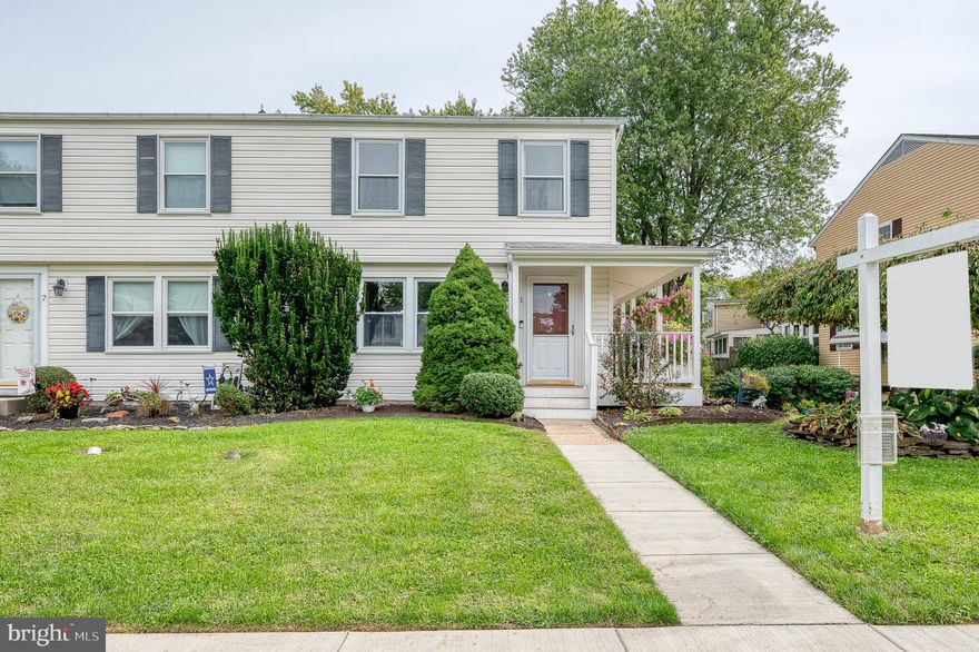 Welcome to 5 Knaves Court, a beautifully updated end-of-group townhome with no HOA! From the inviting wrap-around front porch to the expansive maintenance-free deck, this home has plenty of space inside and out.  Enter into a bright main level featuring luxury vinyl plank flooring, elegant crown molding, and a new powder room with a pocket door. The sunroom addition brings in tons of natural light and has a cathedral ceiling. The kitchen boasts quartz countertops, modern stainless steel appliances and a backsplash. Upstairs you'll find two spacious bedrooms, including one with dual closets, and the other with a walk-in closet and private access to the full bath. Fresh paint and new carpet add a clean, move-in-ready feel. The finished walkout lower level offers endless possibilities—featuring a large family room, full bathroom, laundry area, and even an enclosed hot tub room. It’s perfect for a guest suite, in-law arrangement, or private home office. You'll find two large sheds in the yard for outdoor storage.