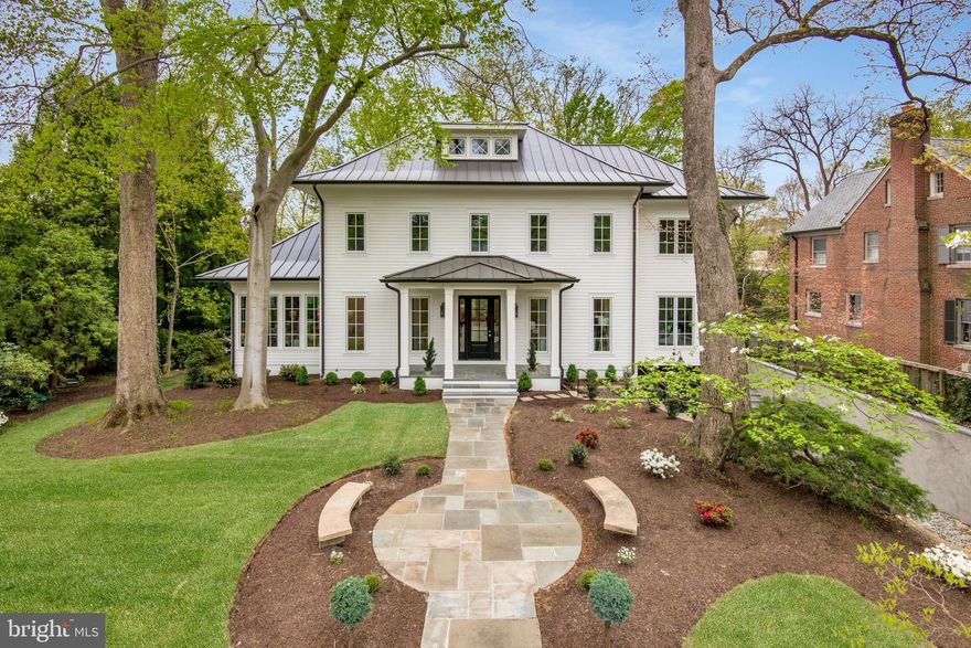 Brush Arbor Home Construction in collaboration with W.C. Ralston Architects and Wellhouse & Co Interior Design has created a bespoke residence sited on a coveted half-acre lot with south-facing exposure,  a wonderful, level rear garden and an attached garage. No detail has been overlooked in this custom new build and design, spanning 5 BR + Den, 6.5 BA, and 6,200 SF. This classic colonial revival residence provides three levels of elegance and exceptional scale, providing tranquility and light.

 Rows of French windows anchor all the primary spaces, yielding bucolic views from nearly every vantage point. The light-filled floor plan integrates 10' ceilings, custom interior and exterior millwork and architectural details, 7” character grade white oak floors, Jeld Wen windows and doors, designer finishes such as lighting by Visual Comfort and fixtures by Kallista, and natural finishes such as L’Isola Black Marble and polished nickel. There is a seamless flow from indoors to outdoors from walls of windows and French doors capturing an inpouring of natural light adjacent to the chef's kitchen with its rigorously curated appliance package, featuring a Blanc La Cornue range with polished brass trim.

 The second level includes a well-appointed primary suite with two very generous walk-in-closets, and the designer tile and custom cabinetry of a spa-inspired bathroom. The exterior has been planned with the utmost discernment, executed to provide a private backyard retreat which features a stone patio, ideal for the addition of any future outdoor amenities and an attached garage. On each level, there is an elevator-ready shaft for potential installation.

Located in close proximity to Rock Creek Park, Soapstone Valley Trail, Redline Metro stop, both Connecticut Ave and Tenleytown/Wisconsin Ave Commercial Corridors, National Zoo, and Forest Hills playground. This superb NW DC area provides easy access to all that the Capital Region has to offer.