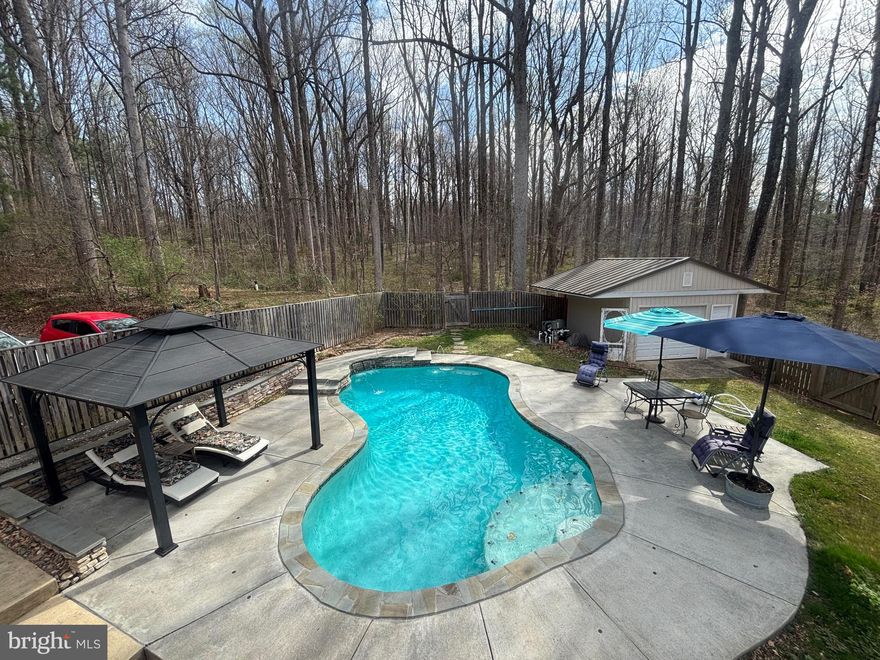 Welcome Home to 7491 Mink Hollow Rd, a true sanctuary located in the beautiful, serene Highland Community nestled within the highly sought-after Howard County. This spacious 6-bedroom, 5-bathroom residence offers an exceedingly rare 6,402 SQFT of luxurious living space, providing a unique opportunity to own a private retreat in this desirable area.

Set back from the street, the home offers unparalleled privacy and tranquility, making it an ideal escape from the hustle and bustle of everyday life. Recently refreshed in 2025, the property boasts new paint in specific areas ensuring a move-in ready experience for the discerning buyer.

Thoughtfully designed with both comfort and functionality in mind, the residence features well-proportioned and interconnected living, dining, and family rooms, creating an ideal flow for daily living and entertaining.  This home is very energy efficient and benefits from an abundance of natural light, and the generous room sizes offer a seamless transition between formal and casual spaces. The chef's kitchen, complete with quartz countertops and high end appliances, adjoins a family room and the main dining room.

The main level features the primary oversized bedroom suite, with ample closet space and a renovated en-suite bathroom with a jetted tub.  Upstairs, discover 4 more bedrooms with closets, 2 full bathrooms. 

The nearly 2000 SQFT lower level provides access to the attached private-car garage and includes a private suite with a separate kitchenette, laundry and spacious family room. This space is perfect for guest accommodations and an au pair suite. The property also features three distinct outdoor spaces, including a hardscaped back patio, a spacious side yard, and an oasis in the front, perched high above the street and surrounded by mature foliage.  Let's not forget about the heated pool that was constructed in 2016, creating its own ambiance with the Chiminea and outdoor features for a grand time with family and friends. The lower space that is currently being used as an office can be converted into a 7th bedroom as there is an adjoining closet space next to the full bath.

Homes of this size on such expansive land are rarely available, offering a unique opportunity to own a sizable estate in Howard County's Highland Community. The property is conveniently located with access to major commuting routes and is close to top-rated schools namely River Hill High, Lime Kiln Middle and Dayton Oaks Elementary.  The ease of access to shopping centers, and local amenities are within minutes of travel time. Enjoy the best of both worlds—peaceful, private living with easy access to everything Howard County and the surrounding areas have to offer.

Don't miss your chance to own this exceptional property and create your own retreat in this beautiful setting. Contact me today to schedule a viewing!