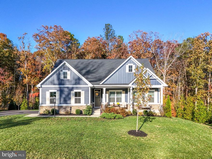 Anchored in the ​luxurious gated lake and golf community of Fawn Lake​ in Fredericksburg, Virginia, this Gorgeous nearly new Dream Home offers ​a modern​, warm and inviting atmosphere ​throughout.
​
Beautifully designed, this ​Modern Rancher built in 2022, boasts ​main level living on a​ flowing open floor plan ideal for​ casual, everyday living​, and entertaining​. 

​At the center of the home is a spacious ​Family ​Room ​that flows seamlessly to an impressive ​Gourmet ​Kitchen featuring a massive island, quartz countertops, double ovens, ​tile backsplash, and a large pantry, perfectly suited for both everyday living and entertaining. The ​adjoining Sunroom flooded with brilliant sunlight, serves as an ideal Dining​ Room. Sliding doors provide easy access to a​n inviting covered porch, perfect for indoor-outdoor gatherings. 
​A quiet retreat, the main level Owner’s Suite with ​private access ​outdoors to the serene covered ​porch, features a beautiful light-filled Spa Bath with dual vanities and tile shower.​ ​Double walk-in closets​ offer plenty of wardrobe ​storage. 

Two additional gracious Bedrooms with walk-in closets share a beautiful Full Bath.
The convenient main-level Laundry Room provides everyday ease.

​Expanding the living space, the amazing walk-out lower level features a massive Recreation Room, which provides unlimited entertainment possibilities. A huge Bedroom with an adjoining Full Bath ​offers comfortable ​extended living for Guests. ​ Glass sliding doors provide direct access to an inviting ​Flagstone patio overlooking the private backyard abutting to a wooded conservation area​.
​ 
​The serene natural backdrop makes outdoor living​ just as special​. Exceptional privacy, peaceful moments and effortless entertaining on the covered rear porch ​can be enjoyed year-round. 
​This turn-key Home is nestled on .40 acres at the end of a quiet​ cul-de-sac, ​near the Fawn Lake Marina​! Take daily strolls or bike rides along the nearby trails ​to​ savor the beautiful sights and sounds of nature​, or meet friends​ at the marina. Imagine​ kayaking, ​paddleboarding, fishing, swimming and breathtaking sunsets​ only steps from your front door! 

Enjoy the exceptional ​Fawn Lake lifestyle and live with ease in this nearly new turn-key home, expertly crafted with energy efficient materials such as a high efficiency HVAC, low maintenance ​Hardi-Plank siding and stone exterior finishes.​  Here you can downsize your home, while elevating your lifestyle!​ Come experience the Fawn Lake Lifestyle and start enjoying our unique way of life!
​
The beautiful luxury and vibrant Fawn Lake Community offers amazing amenities such as a boating recreational lake, sandy beach, an Arnold Palmer designed Golf Course, tennis courts, baseball and soccer fields, dog park, volleyball courts, walking trails, Community ClubHouse, marina, fitness center, restaurants, Country Club, playgrounds, and so much more! Plus with an array of clubs, groups and daily activities, you will have plenty of opportunities to join the social scene, make new friends and remain active all year-round!
Located in the countryside near the town of Fredericksburg, surrounded by park lands and only a few miles to the farm market, wineries, and award winning breweries! Conveniently located to shopping, restaurants, top-rated Riverbend District schools and I-95!​  
Discover refined living in the prestigious lake and golf community of Fawn Lake.