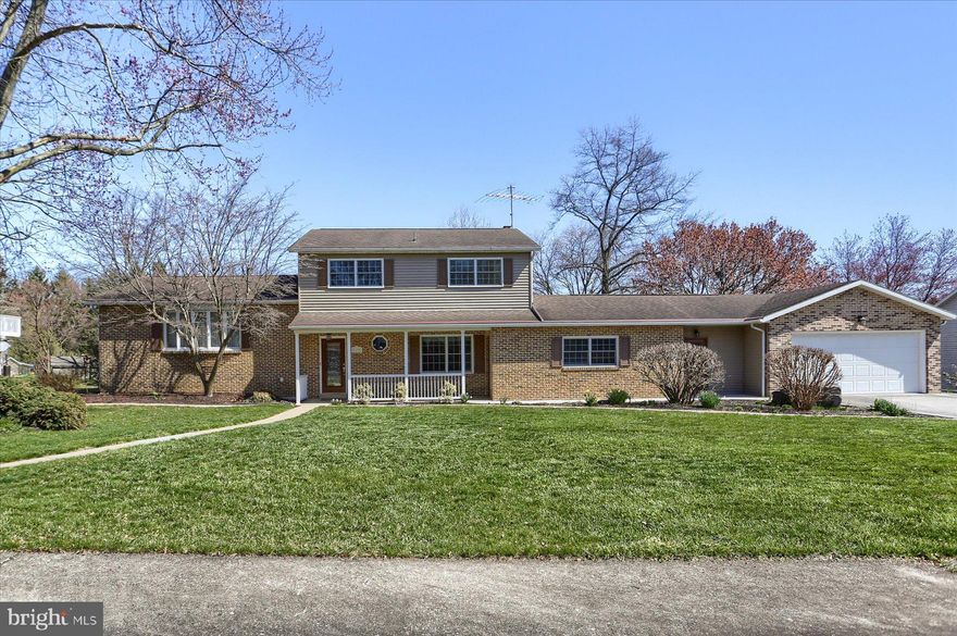 It's easy to appreciate the owners' remarkable attention to details in this meticulously maintained and updated property featuring PELLA and CRADCO WINDOWS with CUSTOM WINDOW TREATMENTS, CENTRAL A/C, HARDWOOD FLOORS and  CROWN MOLDING just to name a few. The main level features a formal living room, dining room, family room with brick wood burning fireplace, kitchen with solid surface counters and stainless steel appliances , 1ST FLOOR BEDROOM W/ATTACHED BATH and a half bath. Upstairs you'll find 3 bedrooms, the primary bedroom/w attached bath and french doors leading  to a private balcony and 2 more generously sized bedrooms with a hall bath. The lower level features a finished recreation room, office and storage area. Keep your cars and other equipment dry in the generously sized 2 CAR GARAGE with enclosed potting shed/additional storage/workroom space.   Minutes from the Carlisle Pike, the War College and I-81; this home offers something for everyone! MOVE-IN READY! Schedule your private tour today before this one gets away.