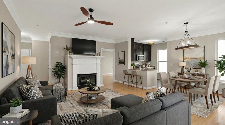 Rare three-bedroom, two-bath condo with two assigned parking spaces in the highly desirable Fitz at Rockville Town Center. Ideally located just a short walk to the Rockville Metro with quick access to I-270, and surrounded by restaurants, shopping, grocery stores, and everyday conveniences. This bright and spacious freshly painted home features an open floor plan with hardwood floors, high ceilings, and abundant natural light. The updated gourmet kitchen includes high-end stainless steel appliances, granite countertops, ceiling-height cabinetry, and generous prep space, perfect for both daily living and entertaining. The primary suite offers a recently renovated private bath, while two additional bedrooms are located on the opposite side of the unit for added privacy, ideal for guests, family, or a home office. A separate laundry room and private balcony add everyday comfort. Condo fee includes cable TV and high-speed internet. Residents enjoy amenities including a pool, fitness center, club room, billiards, media room, and dog play area.