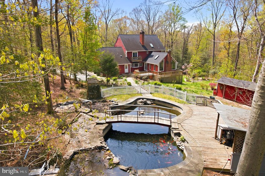 Welcome to this unique 5 bedroom, 3.5 bath Colonial home in Ferry Landing Woods Community.
Over 3 acres of peaceful grounds with a natural masterpiece backyard featuring a picturesque pond with colorful koi fish. 
Entertain in style within the spacious dining room, ideal for hosting intimate meals or grand gatherings. The living room, a gorgeous gathering space, features soaring high ceilings with skylights and uniquely shaped windows that brighten the room and beautifully balance it with a cozy rustic feeling.  At the heart of the home, you'll find a huge chef-level kitchen, perfectly designed for a large scale, seamless cooking and  entertaining. It features a professional-grade gas range with an integrated hibachi griddle plate and a sleek built-in refrigerator for a truly seamless design. This home features a convenient main-level office, perfect for remote work.
The upper level has 4 bedroom with the primary suite designed for ultimate relaxation with newly renovated en-suite bath, features a deep soaking tub and an updated shower, build-in dressing room, and a private deck to enjoy quiet mornings. In additional full bathroom serves the other bedrooms.
The finished basement adds incredible value with a spacious game room with full bar, a dedicated workshop, and additional bedroom provides the perfect guest suite.
The property has been meticulously upgraded including a new septic in 2023, new HVAC in 2024, partial new roof and siding in 2025, new update appliances of washer, dryer, and dishwasher. New well pump and water softener. New front/storm door. Freshly painted throughout, and unified two-key doorknob system. Welcome Home.
Perfectly located for privacy yet easy access to DC and Baltimore via I-95 and Rt. 295.