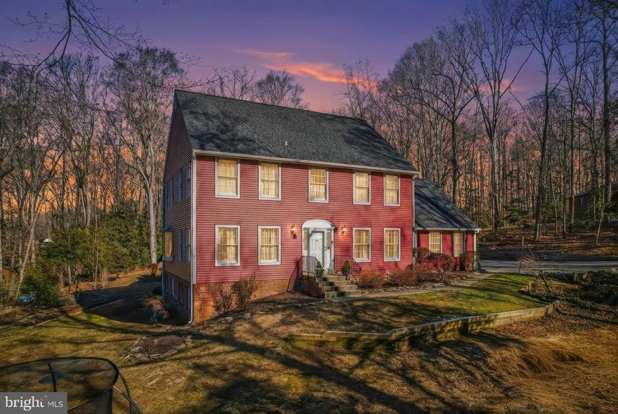 Welcome to this unique 5 bedroom, 3.5 bath Colonial home in Ferry Landing Woods Community.
Over 3 acres of peaceful grounds with a natural masterpiece backyard featuring a picturesque pond with colorful koi fish. 
Entertain in style within the spacious dining room, ideal for hosting intimate meals or grand gatherings. The living room, a gorgeous gathering space, features soaring high ceilings with skylights and uniquely shaped windows that brighten the room and beautifully balance it with a cozy rustic feeling.  At the heart of the home, you'll find a huge chef-level kitchen, perfectly designed for a large scale, seamless cooking and  entertaining. It features a professional-grade gas range with an integrated hibachi griddle plate and a sleek built-in refrigerator for a truly seamless design. This home features a convenient main-level office, perfect for remote work.
The upper level has 4 bedroom with the primary suite designed for ultimate relaxation with newly renovated en-suite bath, features a deep soaking tub and an updated shower, build-in dressing room, and a private deck to enjoy quiet mornings. In additional full bathroom serves the other bedrooms.
The finished basement adds incredible value with a spacious game room with full bar, a dedicated workshop, and additional bedroom provides the perfect guest suite.
The property has been meticulously upgraded including a new septic in 2023, new HVAC in 2024, partial new roof and siding in 2025, new update appliances of washer, dryer, and dishwasher. New well pump and water softener. New front/storm door. Freshly painted throughout, and unified two-key doorknob system. Welcome Home.
Perfectly located for privacy yet easy access to DC and Baltimore via I-95 and Rt. 295.