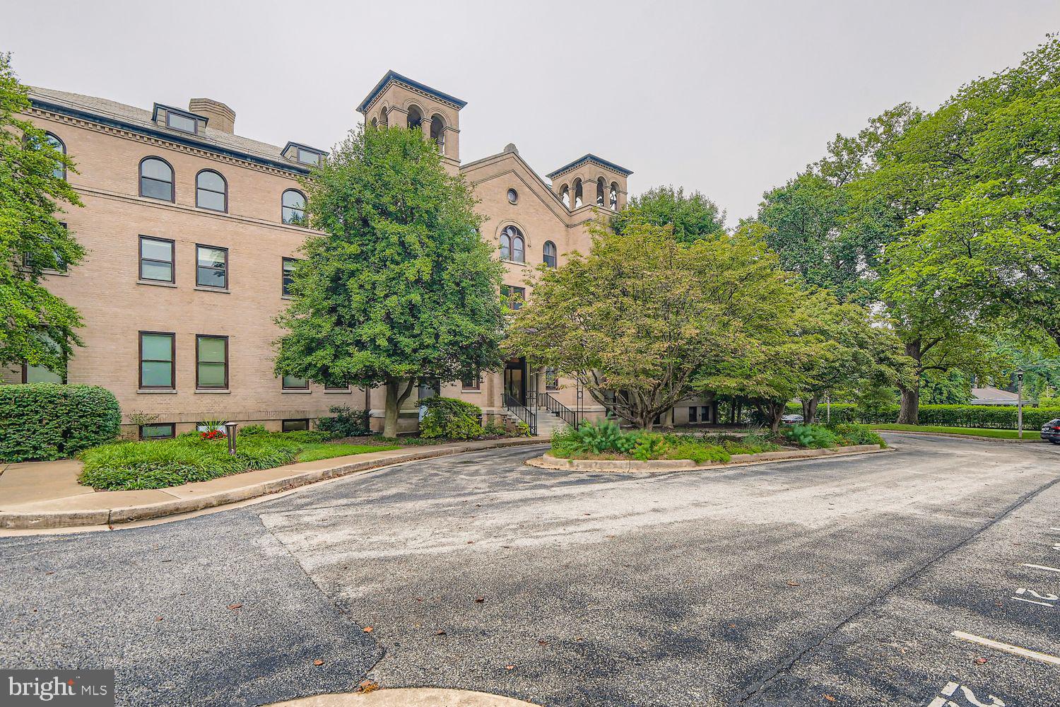 Welcome to 5712 Roland Avenue, Unit TC, a charming 1-bedroom, 1-bath condominium on the ground level of The Bellemore in Baltimore’s historic North Roland Park. Originally built in the early 20th century as a convent and later converted to condominiums, the building blends timeless brick architecture with modern conveniences.
This unit features an open layout with hardwood floors throughout. The kitchen is equipped with rich cherry wood cabinets on both sides and stainless steel appliances. Its ground-floor location provides easy accessibility, while the private rear patio offers additional outdoor space exclusive to main-floor residents. Residents also enjoy amenities such as an elevator, secure entry, and beautifully landscaped grounds.
Perfectly situated in the desirable neighborhood of North Roland Park, The Bellemore offers convenient access to Northern Parkway, I-83, and I-695.