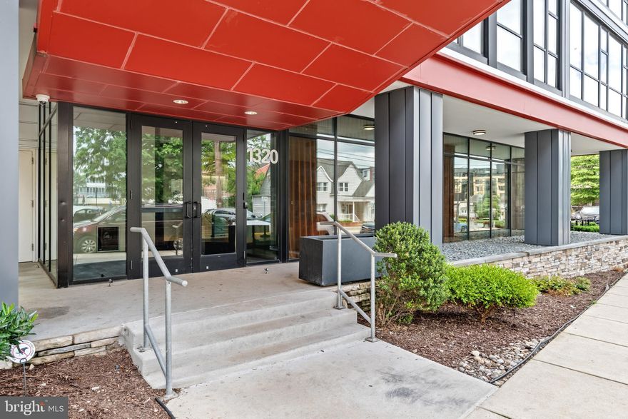 Welcome to this stunning corner unit 2 bed, 2 bath condo at The Octave 1320 in Downtown Silver Spring. Octave 1320 was designed by BKV Group and developed by ProMark Real Estate Services out of a repurposed office building. Built 1964 but renovated in 2016 into condos, this building has 8 floors and a number of amenities. Because of the concrete office floor construction, you hardly hear your neighbors. There is an enclosed rooftop lounge which can be reserved for private parties (used by residents and guests but privately reserved for a fee) and a roof deck which has views of the Silver Spring skyline. The is a first-floor lounge features tables that you can work from home without actually working from home, and a bike storage room and separate storage room (assigned storage for this unit is #2 and is located in the lower level). The fitness center is located in the lower level of the building. The concierge works 7 days a week and will store your packages in a secure package storage room.

Walk into the front hallway which the current owners had set up as a home organization spot with the family calendar, mail station and more. The hall closet features a custom storage system and full-size in-unit laundry. This condo features a modern open concept living space with floor to ceiling windows. The kitchen offers grey cabinets, a gas stove, white title backsplash, and a built-in microwave and dishwasher. There is a pantry cabinet for all your food supplies. The Juliette balcony adds that extra pop of charm. There are two bedrooms and bathrooms in this condo. The primary suite has lots of light and floor to ceiling windows. The primary bath has a large shower and the closet features custom shelving. The hall bath features a bathtub shower combo.

Because of its recent construction, this condo features track lighting, recessed lighting and a sprinkler system. Parking in this unit does not convey. You can add your name to the parking wait list to get something assigned to you. You can park in the lot for $130/month or the county lot next door for $132/month.

As for location, you can’t get any better. This condo is in the heart of Downtown Silver Spring with everything that entails – restaurants, shops, movie theatre, the Silver Spring Library, the Fillemore, etc. Walk to the metro for the Silver Spring red line and the Purple Line which will be opening in a few years. You are also very conveniently located with just a short walk to the local breweries.

Improvements:
Freshly painted throughout, June 2023

Condo fee: $789/mon
Condo fee includes: Amenities – rooftop lounge, roof deck, first floor lounge, bike storage room, storage unit, fitness center, maintenance of the building, building utilities, water, property manager on-site.