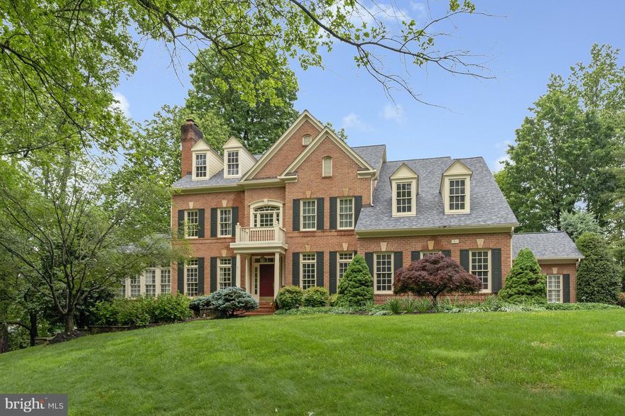 Impressive brick colonial on a generous .9 acre lot, with 6BD, 6FB, 2HB and an expansive 7,630 square feet of living space across three thoughtfully designed levels. Located within the sought-after Reserve, in the Langley High School pyramid, minutes to Tyson’s and major commuter routes. 

The main level features hardwood floors throughout and a two-story foyer that leads to a spacious two-story great room, with a gas fireplace and oversized windows, overlooking the tree-lined back yard. A main level ensuite bedroom, ideal for guests or multi-generational living, is nicely tucked away from other gathering spaces, with direct access to a private deck and back patio. The open concept eat-in kitchen, with a large center island and breakfast bar, offers plenty of seating for casual family meals and a great spot for crafts or homework! A separate dining room, formal living room, home office, four-season room and additional sunroom, laundry room and powder room complete this level. 

On the upper level are four well-proportioned ensuite bedrooms, including the primary bedroom suite. The expansive owners’ suite features a separate sitting room, two walk-in closets, a home office space and a large bathroom with dual vanities, 2 private toilets, a soaking tub and a separate walk-in shower. 

The walk-out lower level is designed for family fun and hosting friends, featuring a bedroom and full bath, a family rec room with direct access to the back patio, a game room with a full bar, and a bonus space which is ideal for a wine or bourbon tasting room, an exercise or music room, or playroom! With an additional 1,200+ sq ft of unfinished storage space, you’ll have options for building out a media room and still have space for storing and organizing. 

The landscaped exterior features mature shade trees, low maintenance perennials and shrubbery which creates privacy on the large deck or on the patio with stone water feature below.  A three-car side-load garage provides ample parking and storage. Public water and sewer. Gas-powered whole house generator. New attic insulation and roof replaced in 2021, new HVAC system installed - July 2025.