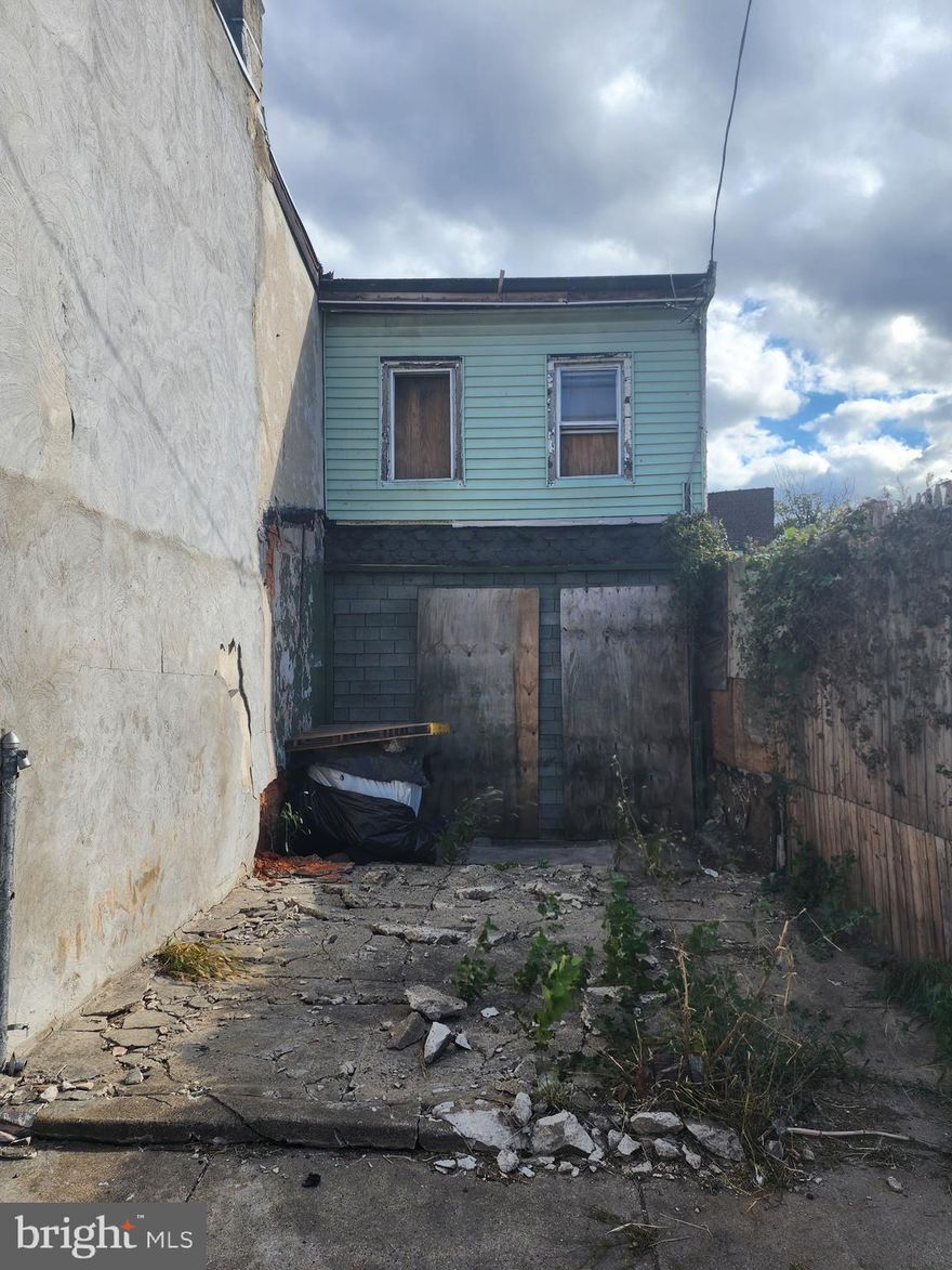 This is Not a house . This is a lot . The front and side wall are standing. Everything alse from the house is gone . This is 863 sqft Lot pretty much . 

OPA : 451136900