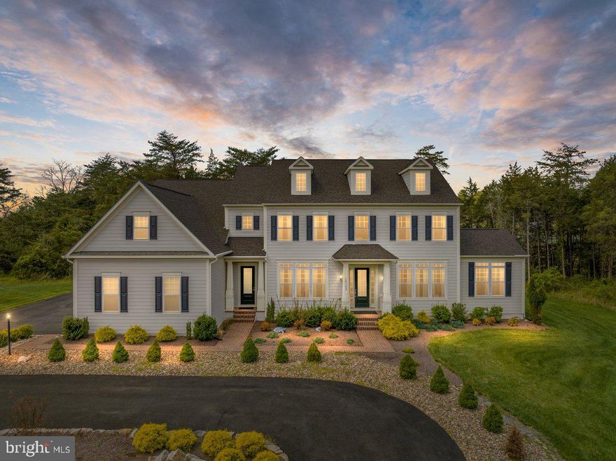 Welcome to this exquisite home nestled on over 5 acres which offers an unparalleled living experience. This residence epitomizes luxury living with it's gorgeous front elevation, excellent curb appeal, HardiPlank siding, and spacious 3-car garage.  As you approach, you'll be greeted by the lush landscaping and large pull-around driveway, providing ample space for guests. The property's picturesque backdrop of woods ensures privacy and tranquility. Step inside to discover over 7,500 finished square feet of meticulously crafted living space. The main level boasts a grand entryway adorned with modern light fixtures and gleaming hardwoods. Entertain in style in the dining room, featuring crown molding and a large window offering scenic views.  A formal living room with a cozy sitting room bump-out provides an inviting atmosphere. Additionally, a main level bedroom and full bathroom offer convenience and flexibility. The heart of the home lies in the family room, boasting 10-foot ceilings, crown molding, and seamless hardwood flooring that flows into a gourmet chef-style kitchen. The kitchen is a culinary dream, equipped with quartz countertops, a massive center island, stainless steel appliances,  two sinks, two dishwashers, double wall ovens, and a large walk-in pantry. A mudroom with a private entrance and a butler's pantry add to the home's functionality. Enjoy year-round relaxation in the sunroom, which offers access to a wrap-around flagstone patio, perfect for outdoor gatherings. Ascend the hardwood stairs, accented by elegant rod iron railing, to the upper level landing.  Upstairs, retreat to the primary suite featuring a sitting area, tray ceiling, and a runway-style walk-in closet with built-in storage. The ensuite bathroom is a spa-like oasis with it's massive frameless shower, double shower heads w/ rainfall feature, a luxurious standalone deep soaking tub, and dual vanities with quartz countertops. Three additional bedrooms, each boasting walk-in closets and full private ensuite bathrooms, provide comfort and privacy for family and guests. The finished walk up basement offers even more space for entertainment and relaxation, featuring a large recreational area, a wet bar with sink and dishwasher, a bedroom with a walk-in closet, and a full bathroom. Ample storage is available in the large storage/utility room, under stair storage closet, and additional storage room with an epoxied floor. Movie enthusiasts will appreciate the dedicated movie room, equipped with built-in surround sound and wired for a projector.  Don't miss this rare opportunity to own a magnificent property offering unparalleled luxury, comfort, and privacy! Schedule your showing now, 3D tour, Floorplans, & Walk Through Video Available.